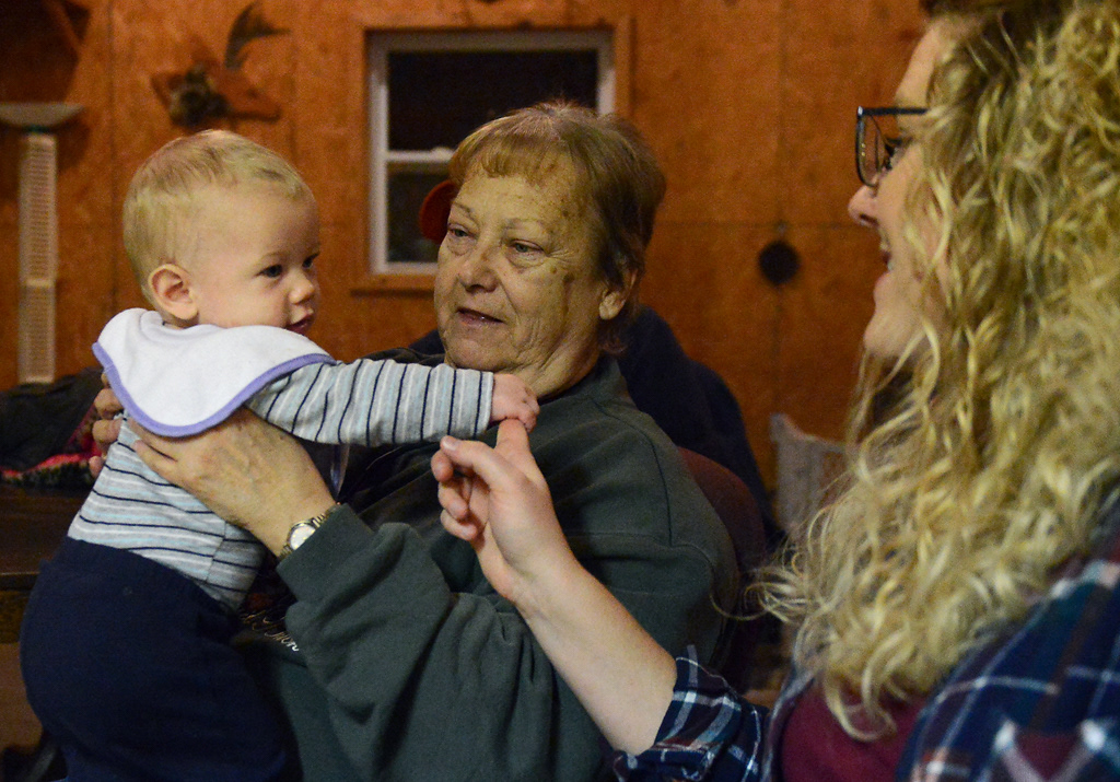 Shad Junior “SJ” Noltensmeyer, 6 months, holds Beth Bruckerhoff’s finger while Glenda Noltensmeyer holds him during deer camp Friday, November 15, 2019 in Rhineland, Missouri. Some people at deer camp came in from Hermann and as far as O’Fallon and St. Louis for the weekend.