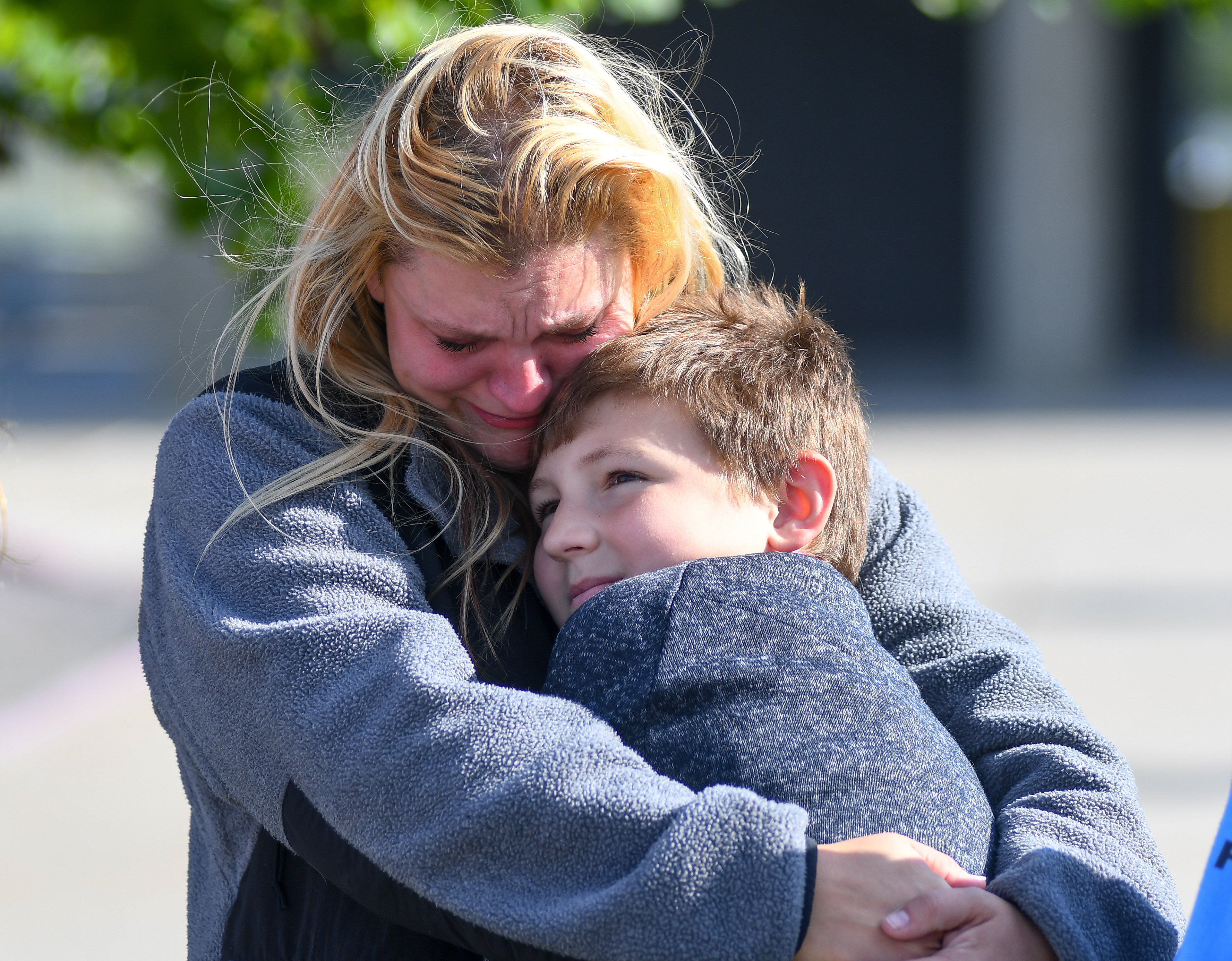 Gabriella Curry's mom, Cheyenne Curry, hugs her son and Gabriella's older brother, Tristan Curry, 10, on Friday, October 4, 2019 at Battle High School in Columbia. "Point blank, period, the end, they stole her. I don't care if it was an accident, it was reckless," Cheyenne Curry said of the person driving the car who hit her daughter.