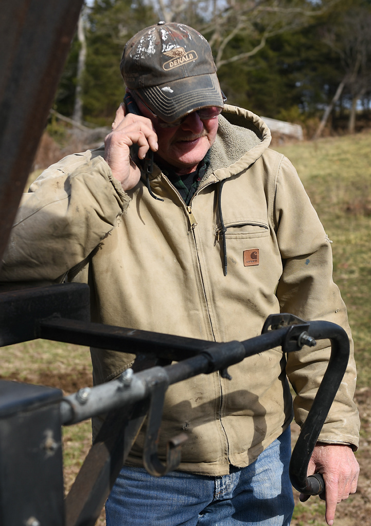 Steve Wehrle pauses from attaching a trailer to his truck to take a phone call Sunday, December 8, 2019 in Rhineland, Missouri. Wehrle borrowed the trailer from a friend that day because his trailer was tied up somewhere else.