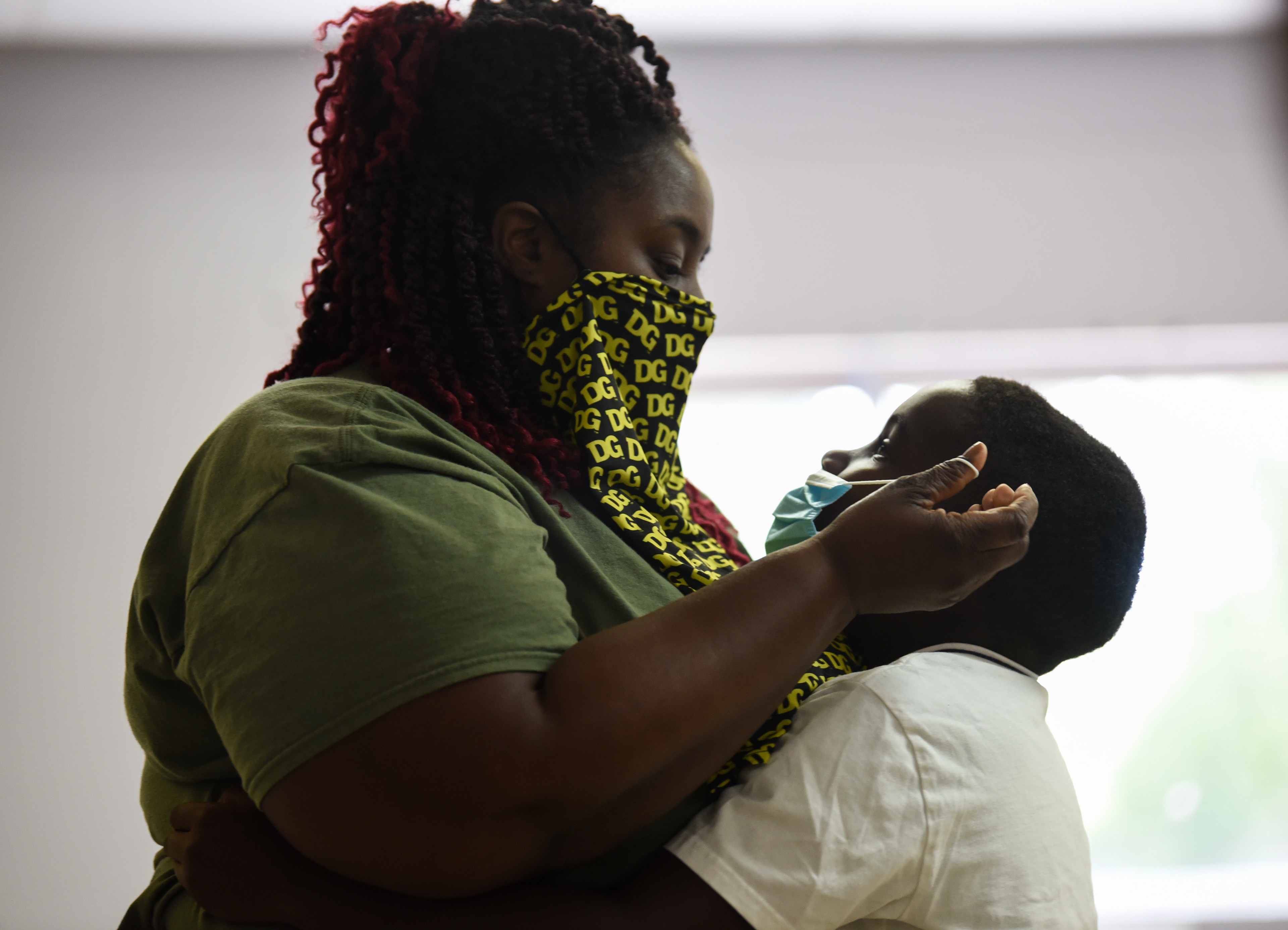 Cherries Bibbs hugs her son Cameron Bibbs, 7, after he performed a praise dance on the last day of Ms. Smith’s Academic Summer Camp on July 24 at the Needmore Center in Starkville. After a week of sanitizing the facility and preparing for the school year, Ms. Smith’s Educational Services will begin programming again on Monday. They will have some homeschooled students, some students doing virtual school, and some students who come after school.