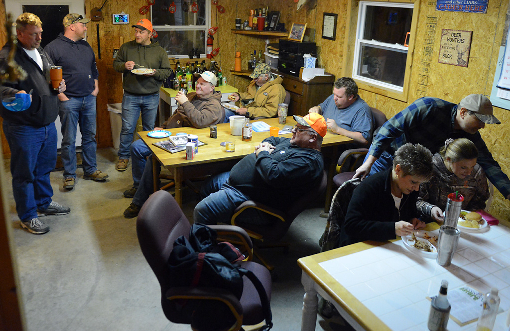The Bruckerhoff family and friends socialize in The Shack on the Bruckerhoff’s land during deer camp Friday, November 15, 2019 in Rhineland, Missouri. The family built The Shack to serve as a gathering place where they could all enjoy each other’s company. Before this building was completed in 2009, the family used a shack that didn’t have electricity but did have a mice problem.