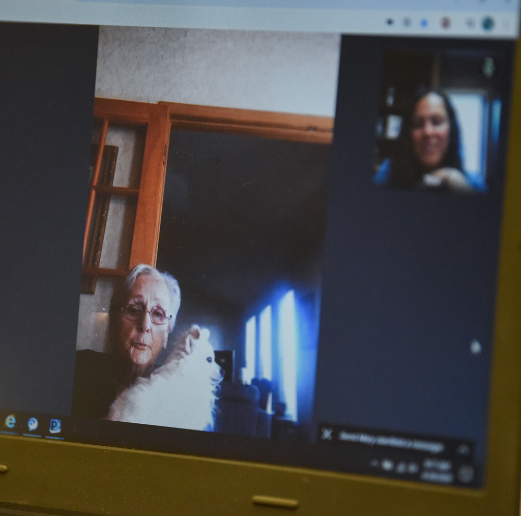 Mary Stanfield holds her dog Casper while on a virtual visit with Sarah Kirchhoff on Tuesday, April 28, 2020 in Concordia. As a precaution, the Western Missouri Family Healthcare has as few people visit the clinic as possible. Instead, patients have virtual visits using a program called Doxy.me. Kirchhoff said converting to telehealth visits hasn’t been a simple process. “We have a little bit of an older population. So trying to teach them how to be able to use a virtual software like that has been a little bit challenging,” Kirchhoff said. “But at the same time, since our patients know us really well, they can always call us if they have issues and they've been really flexible.”