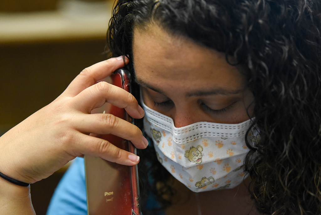 Sarah Kirchhoff dictates notes into her phone after a routine physical with a patient on Tuesday, April 28, 2020 at the Western Missouri Family Healthcare clinic in Concordia. Normally, Kirchhoff brings her laptop into the patient’s room and types her notes directly into their chart. In an effort to minimize exposing people to extra surfaces, she has resorted to writing notes on a notepad while in the appointment and adding them to the chart later.