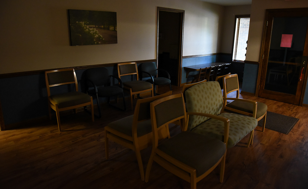 Lights are dim in the waiting room on Tuesday, April 28, 2020 at the Western Missouri Family Healthcare clinic in Concordia. To minimize person-to-person contact, the clinic has moved most of its appointments to virutal visits and has a sign posted on the door instructing people to call the clinic before coming inside the building. Of course, not all in-person visits can be avoided. “Patients still have high blood pressure and patients still have diabetes, even with all of this going on, so we’re really trying to make sure that we're not letting their chronic conditions fall through the cracks,” Kirchhoff said.
