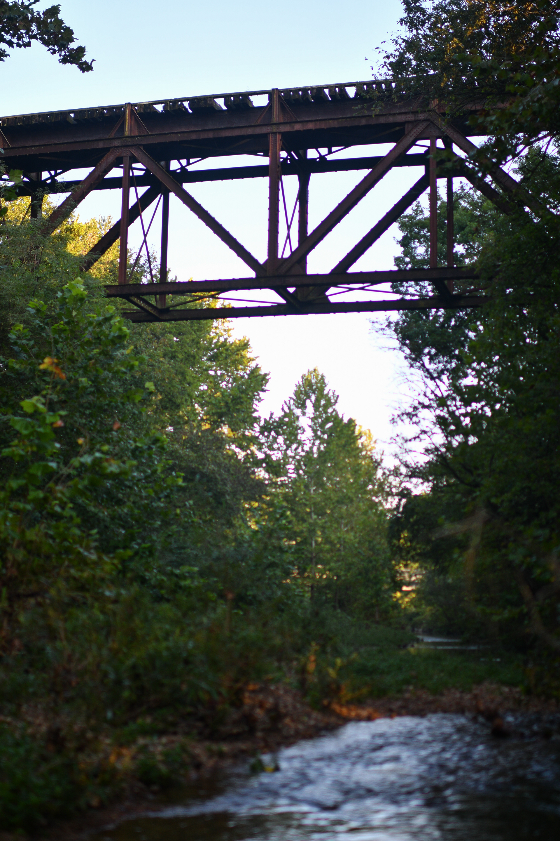 Haw Creek flows under an abandoned railroad bridge on Tuesday, Sept. 3, 2019 near Stover, Missouri. This bridge is part of the Rock Island Corridor that is being considered for a new bike path.