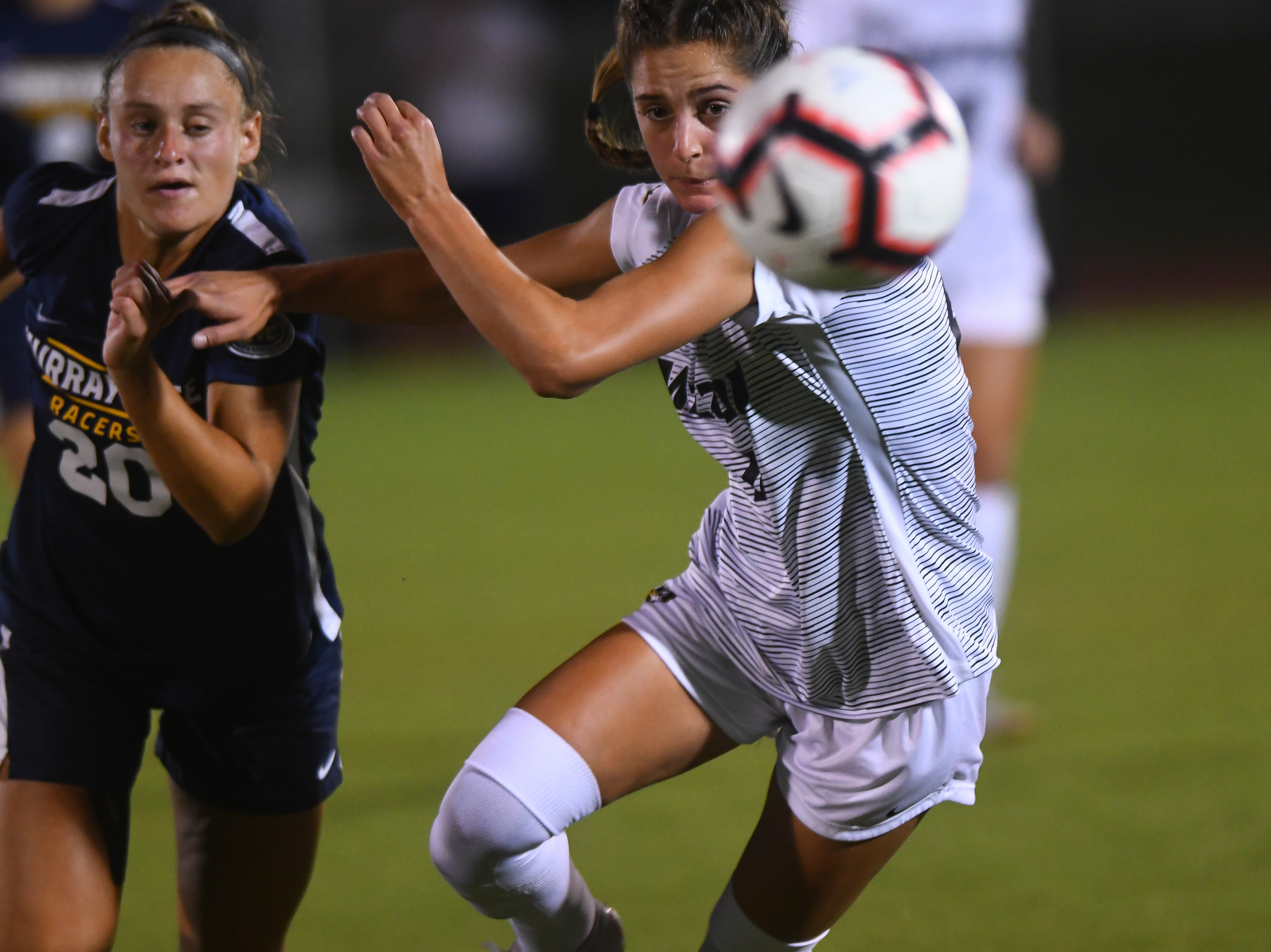 Midfielder and forward Bella Alessi competes with Murray State forward Rebecca Kubin to chase down the ball on Thursday, September 5, 2019 in Columbia. Thursday's win continues Missouri's undefeated streak, raising their season record to 5-0.