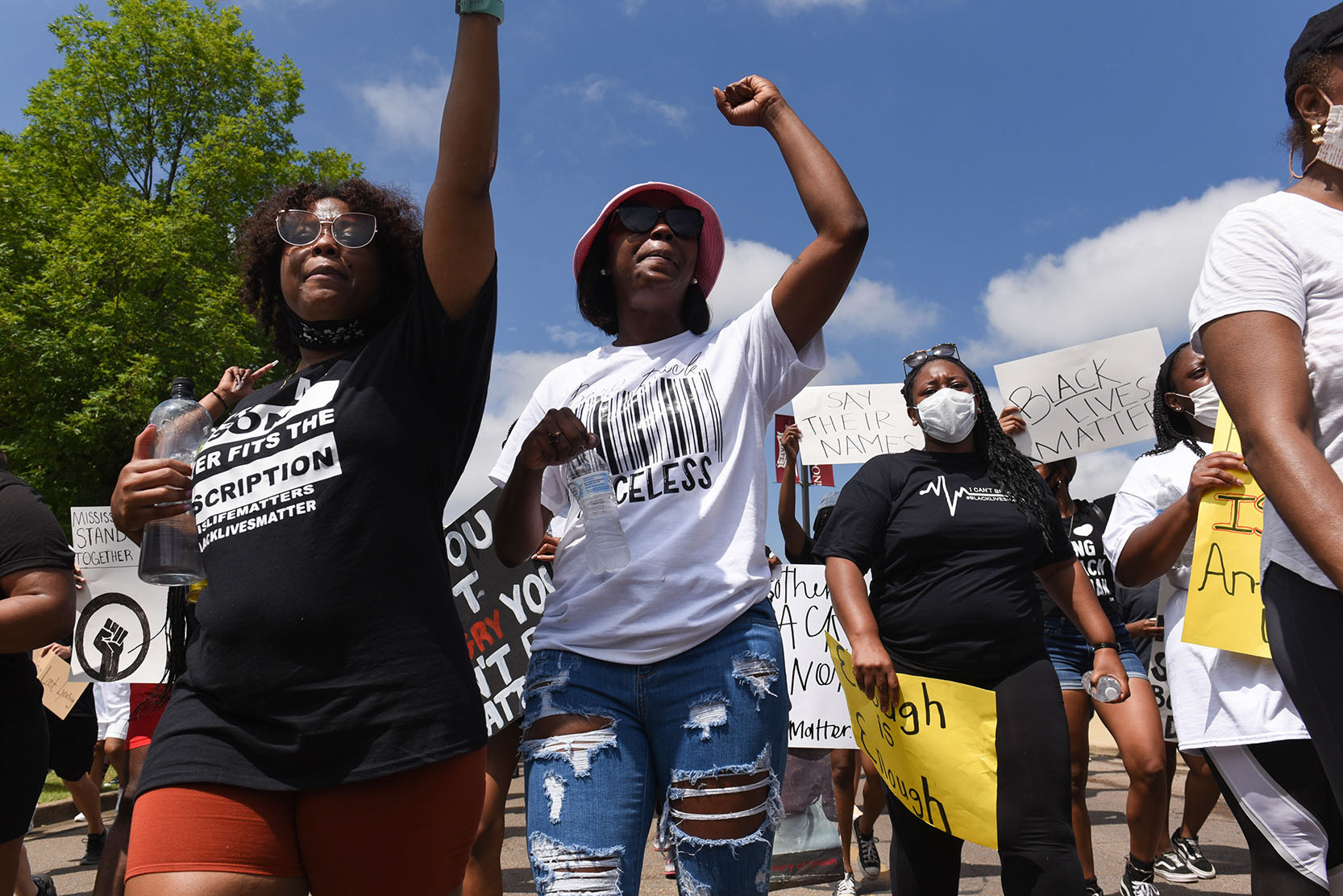Protesters raise their fists during the Starkville Stand Up Justice March on Saturday, June 6, 2020 in downtown Starkville. The march began at Unity Park and protesters walked 1.5 miles through downtown Starkville to the Mississippi State Amphitheater, where there was a rally.