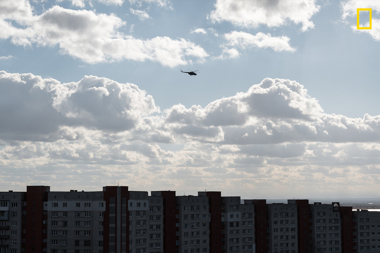 A military combat transport combat helicopter belonging to the Armed Forces of Ukraine whines over the city.