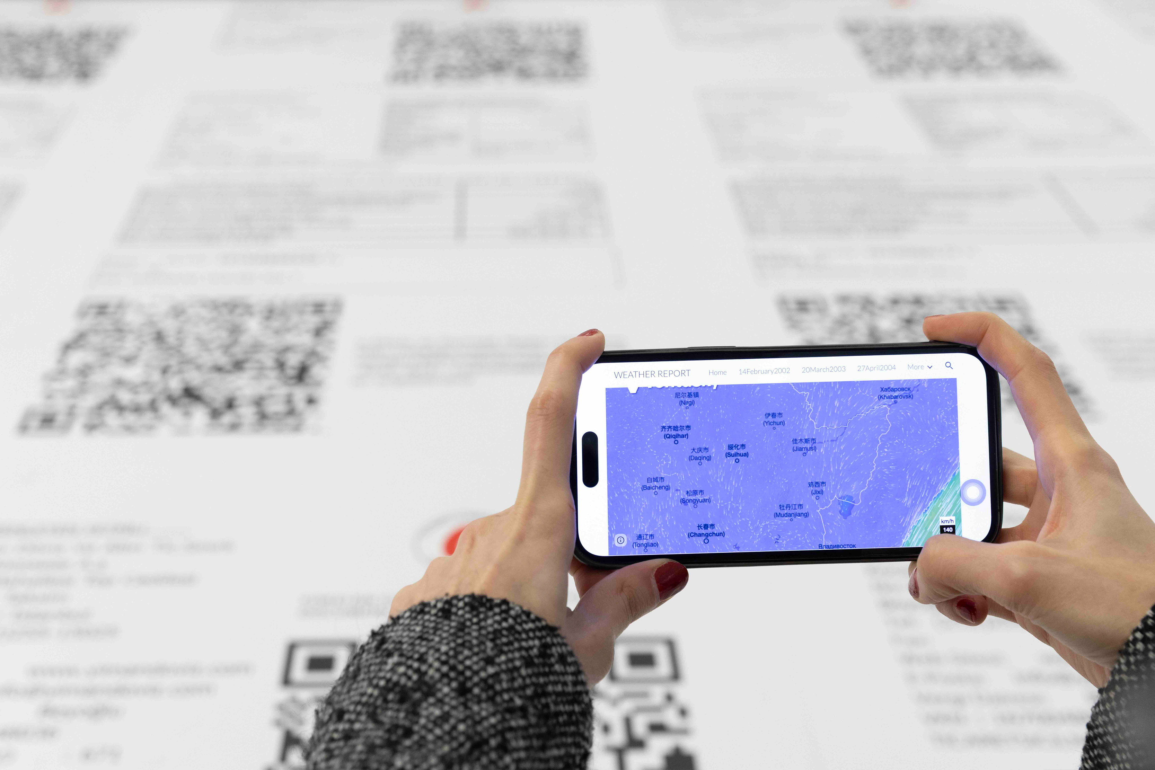 Weather Report, 2026 Installation with enlarged financial receipts and QR-linked historical weather data