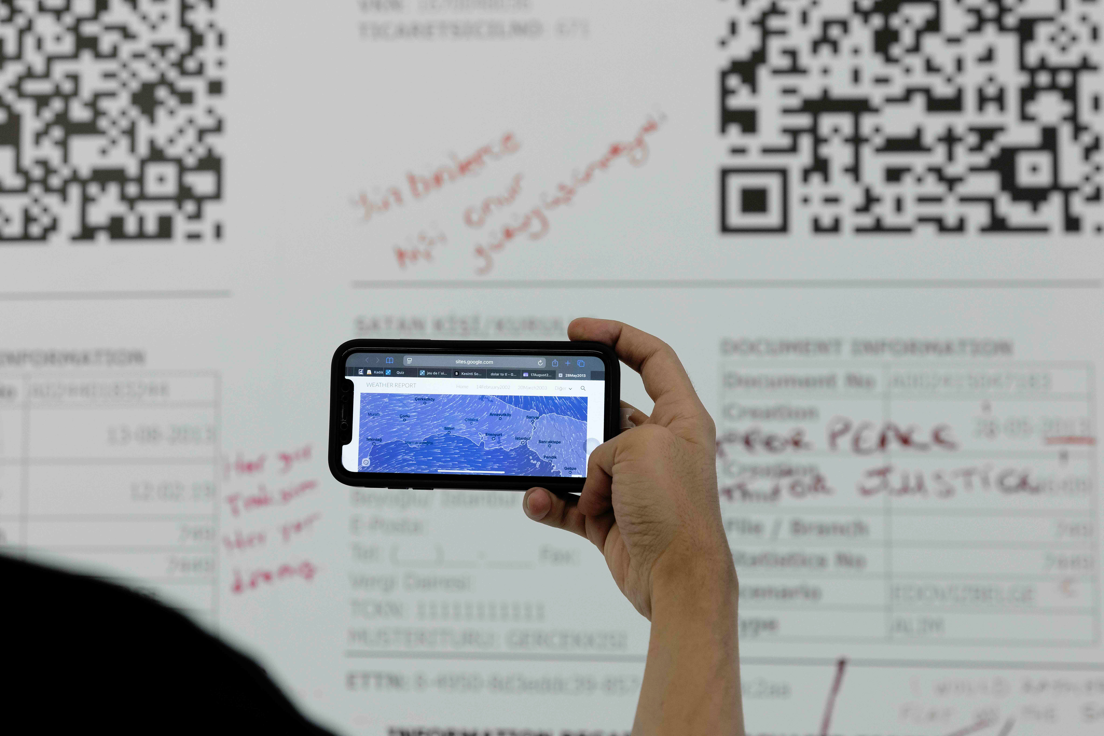 Weather Report, 2026 Installation with enlarged financial receipts and QR-linked historical weather data