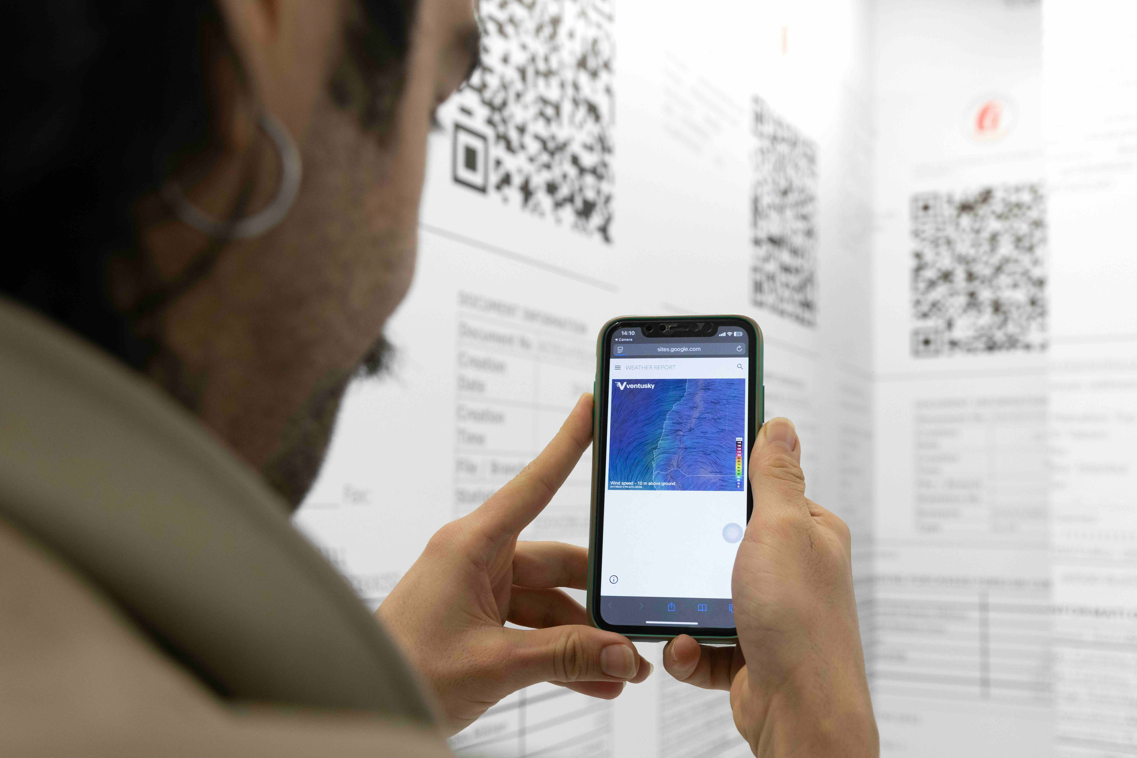 Justice & Development Party / Weather Report, 2026 Installation with enlarged financial receipts and QR-linked historical weather data