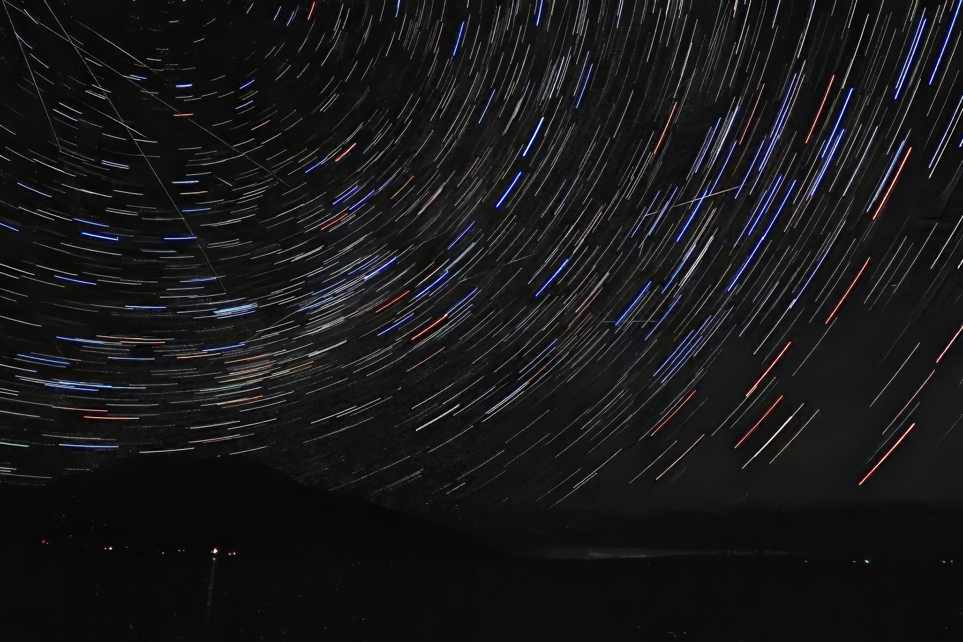 Startrails wheeling above Great Oyster Bay, with meteor trails