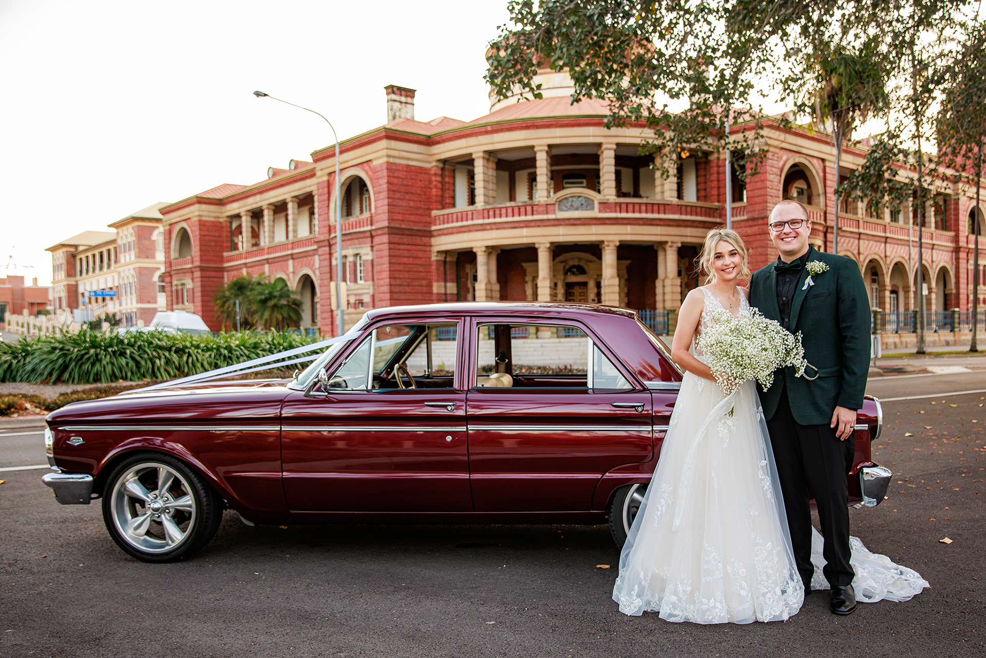 wedding bride and groom with car