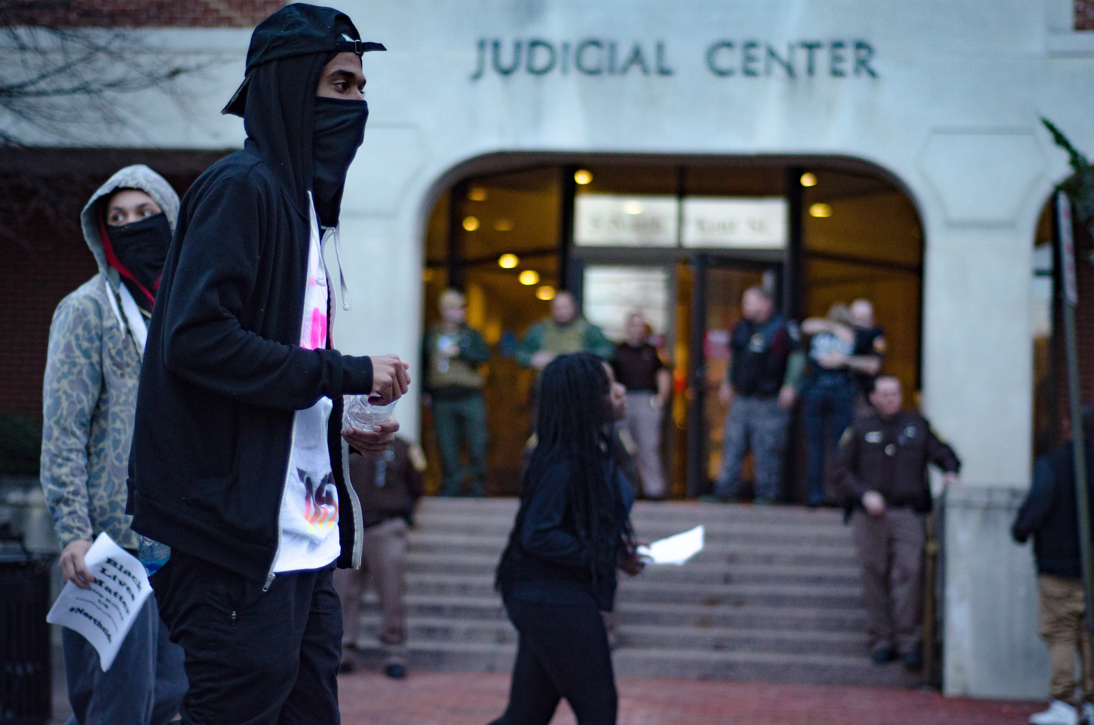 Demonstrators pass the Frederick/Winchester General District Court building as part of protests after the death of D'londre Minifield, a black man, during a police chase. The death was ruled a suicide by Virginia State Police, but the protests led to various police reforms for local law enforcement, whose members are overwhelmingly white. // MARCH 1, 2016, WINCHESTER, VA