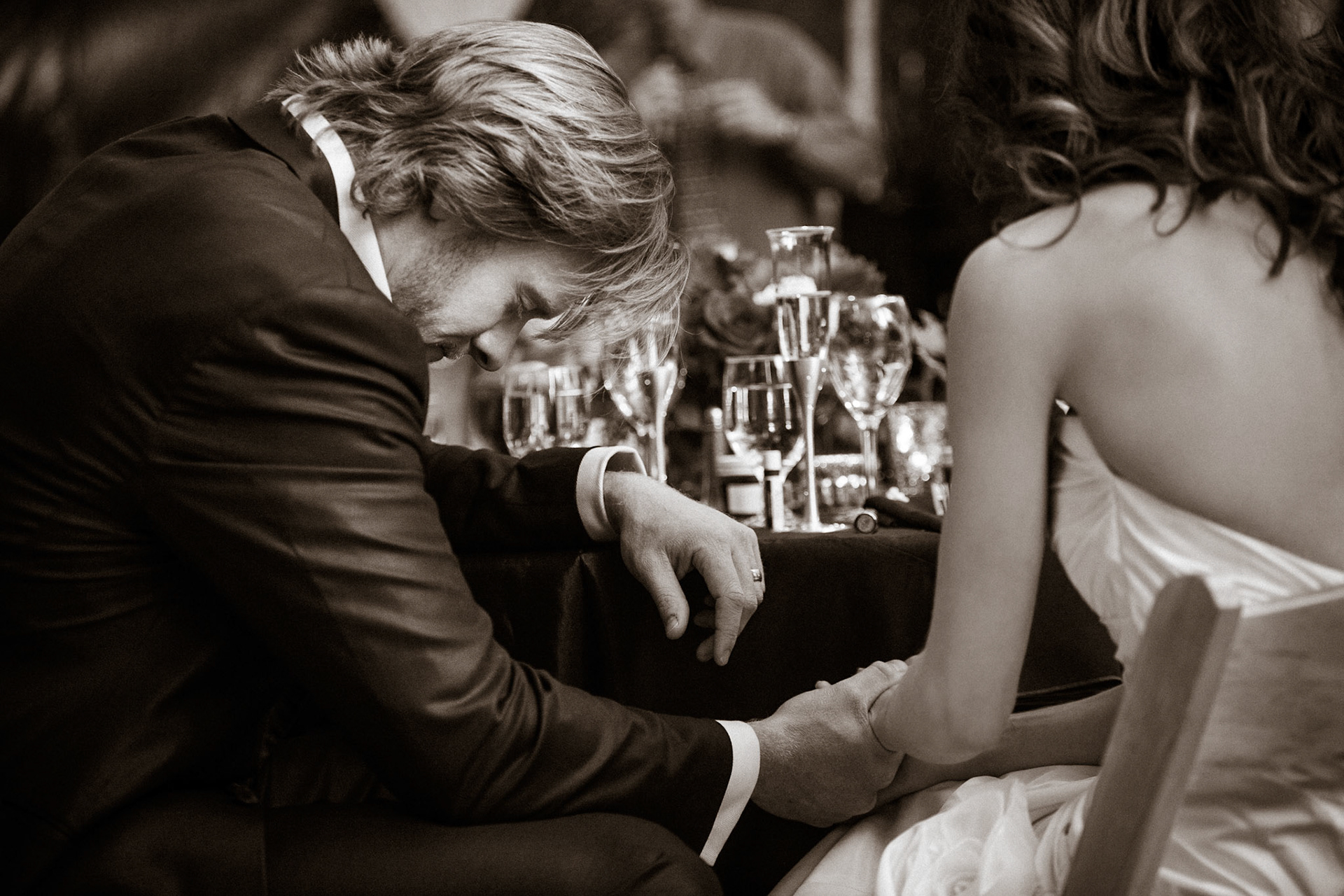 Bride and groom praying at their wedding reception in sedona arizona