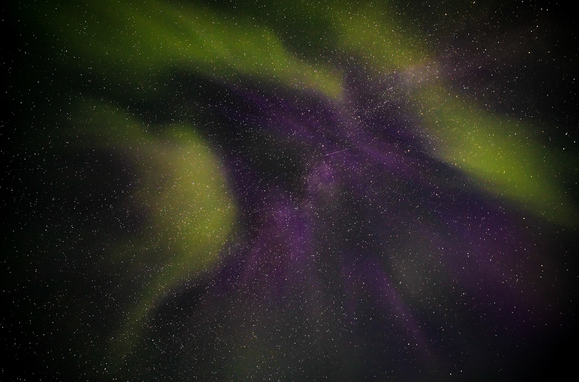 Sometime after the sun dropped in Iceland, someone in the area started yelling, look at the sky.  There was a strange, glowing cloud wiggling its way through the sky.  I had no idea it was the Northern Lights.  Until I took a photo of it.  Then it lit up green and purple.  I knew what I was seeing.