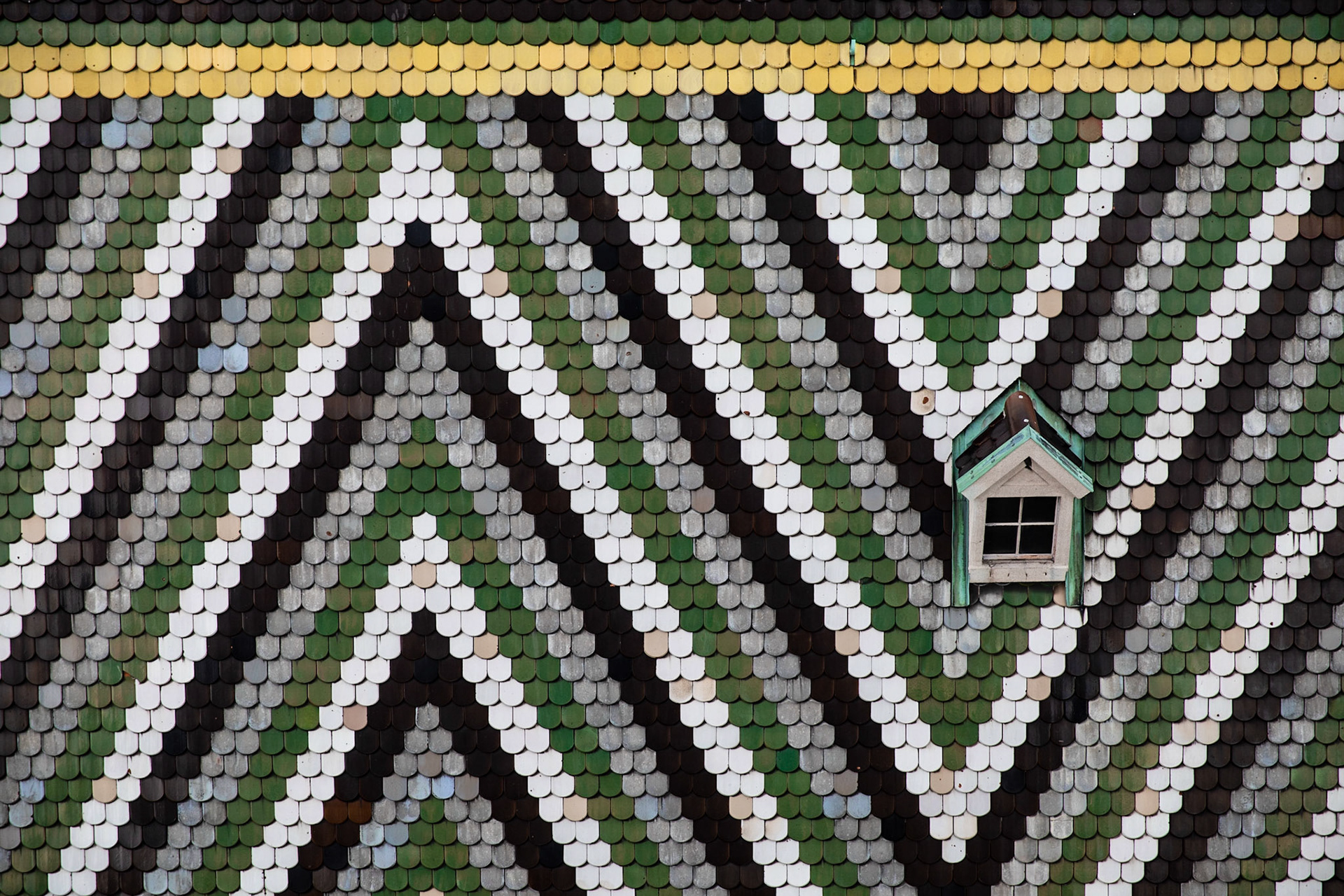 From the very top of the Cathedral of St. Stephan in Vienna, which is a very long climb, you not only get a lovely view of the city, but of the beautiful shingle work on the roof.  I love the graphic design on this rooftop and enjoy letting my eyes wander around catching the discolored shingles.  Isn't that the natural yearning of the human mind, to look at a pattern and then to stick on the anomalies in that pattern.  The real trick to being a better human is not to ignore the differences in the pattern, but to see them and appreciate how useful they are to the overall composition of the whole.  And yes, even the big interruptions in the pattern are valuable to the composition.  Don't destroy the rooftop because the green shingles are not all the correct color of green, or because some of the grey shingles kept too much of their original blue.  The rooftop is beautiful because of the harmony and the imperfections.  @canonusa @tethertools @triplescoopmusic @shootdotedit #Vienna #austria #travelphotography # architecturalPhotography #lifeLessons @atlaspacks #learnphotography