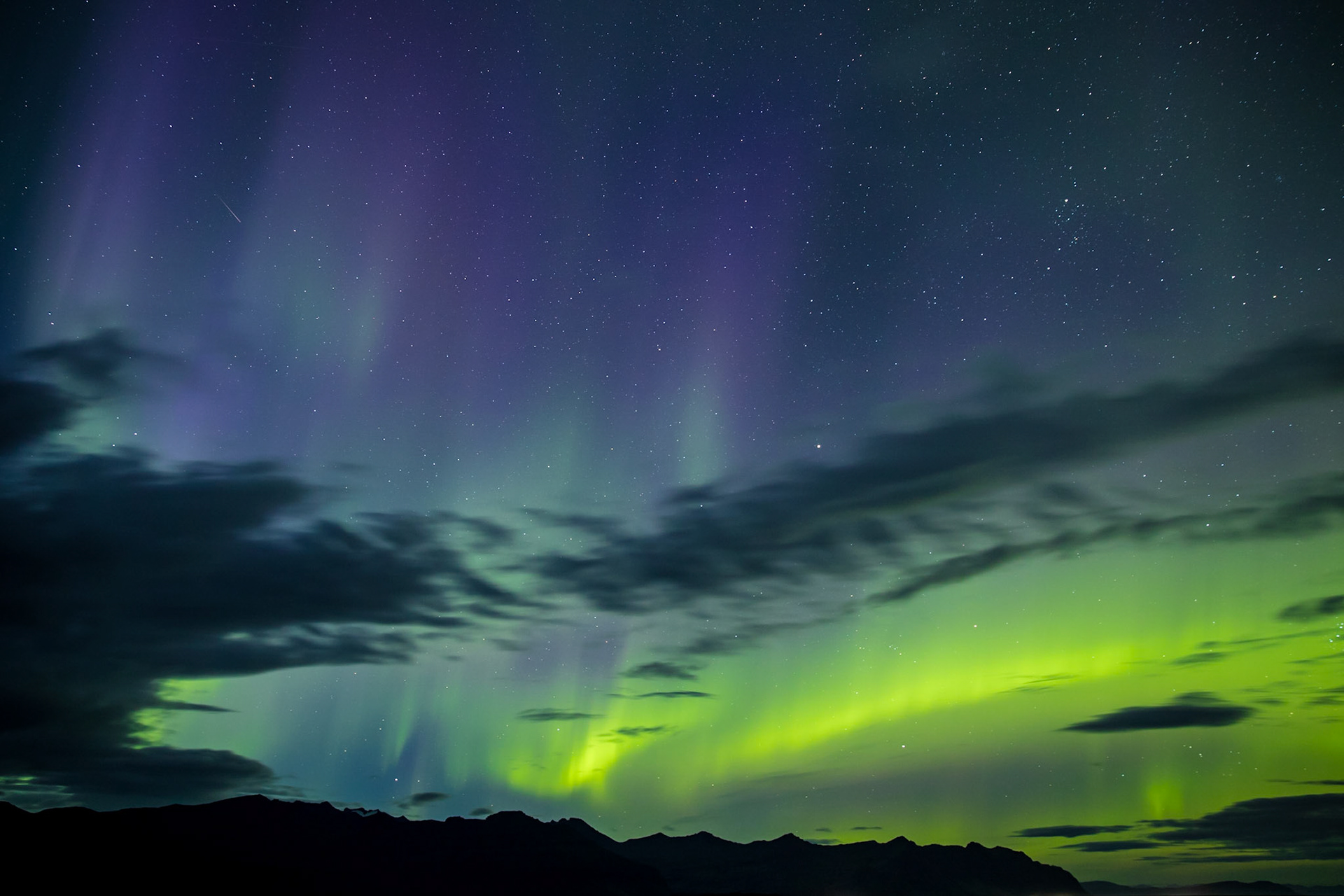 Sometime after the sun dropped in Iceland, someone in the area started yelling, look at the sky. There was a strange, glowing cloud wiggling its way through the sky. I had no idea it was the Northern Lights. Until I took a photo of it. Then it lit up green and purple. I knew what I was seeing.