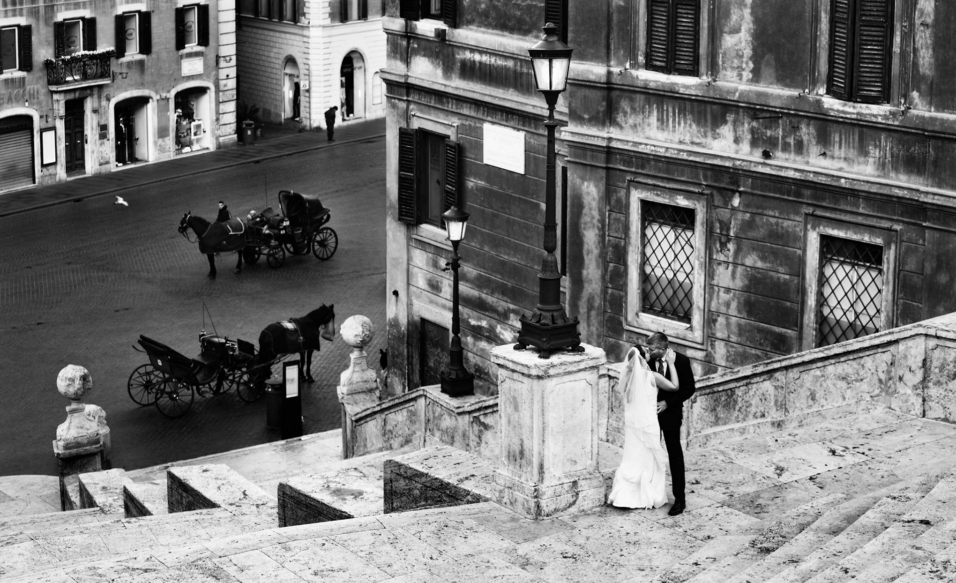 Wedding portraits of the bride and groom on the spanish steps in Rome, Italy