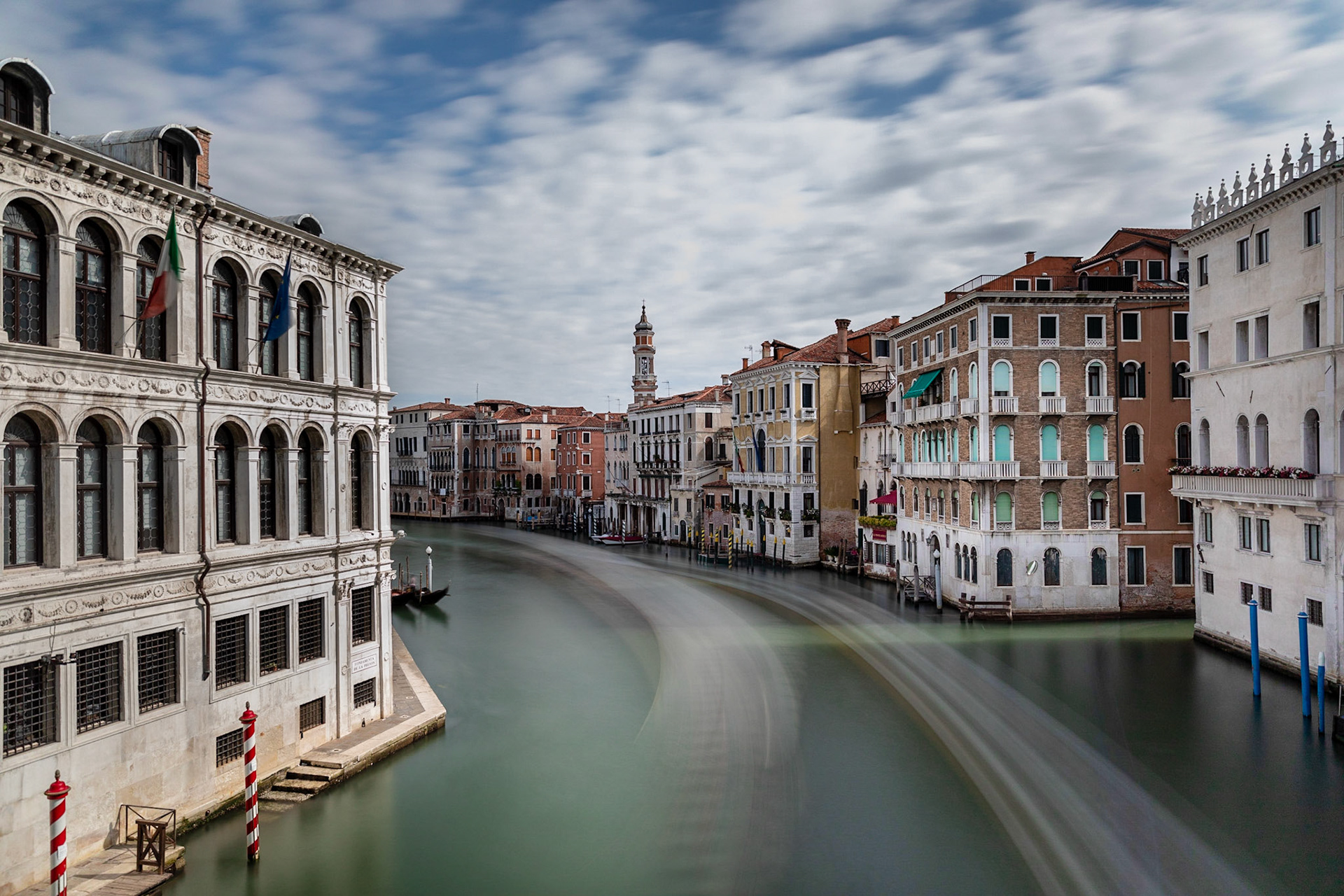 We went to the Rialto Bridge early in the morning to escape the shoulder to shoulder crowds.  Of couse the grande cannal was still full of boats, but I made them disapear with a very long shutter speed.  30 Seconds was enough, but in order to do that, I also had to use my ND (Nutral Density) filter.  All ND Filters are not made equal.  Most of them shift the color quite a bit and most of those color shifts are ugly.  More expensive often means lesss color shift, but the ICE ND Filter is not expensive at all and has very little color shift.  I highly recomend it.