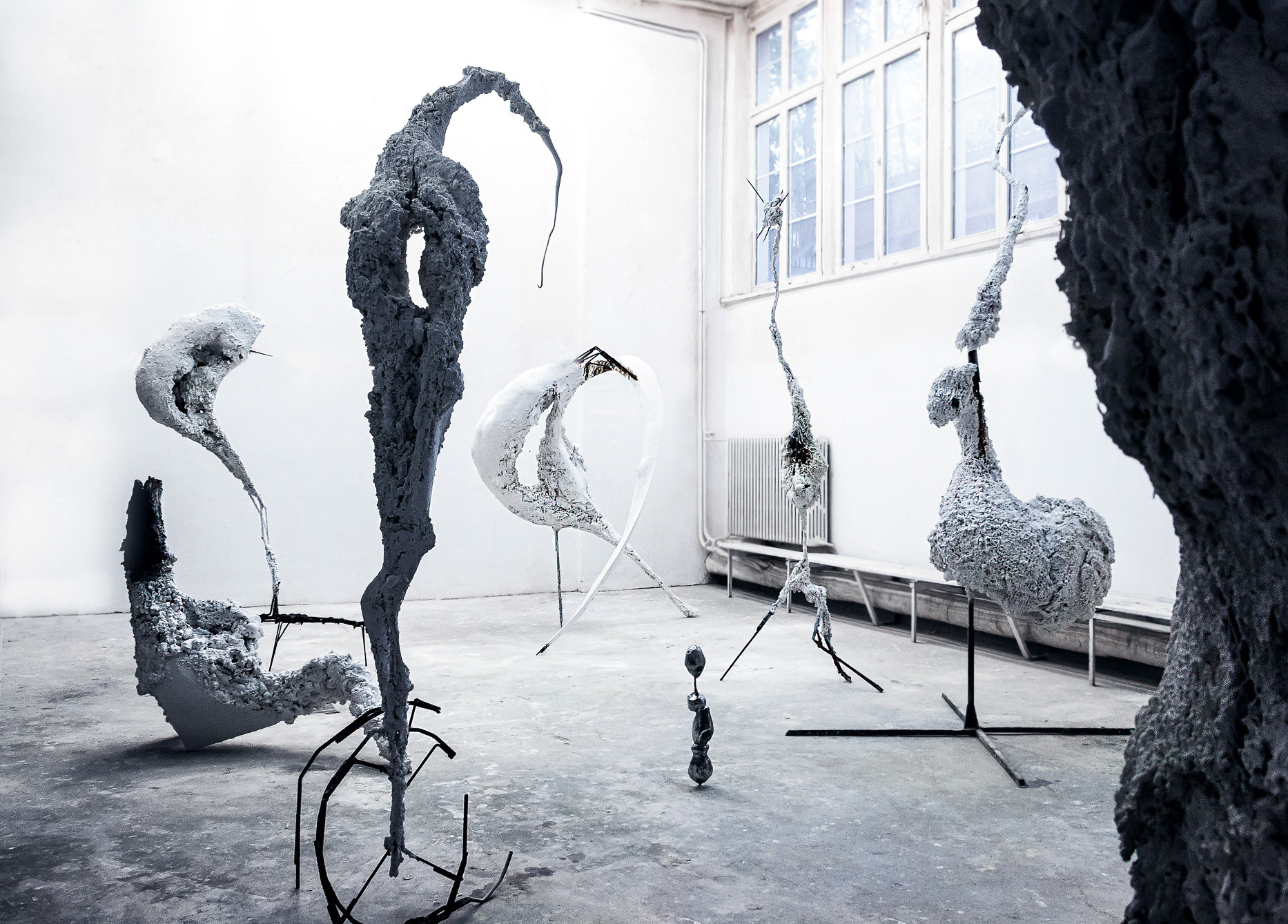 View of the full ‘Non-Humans’ sculpture installation (2019, Warsaw) by Jan Gostyński, featuring nine polyurethane, epoxy and steel sculptures.