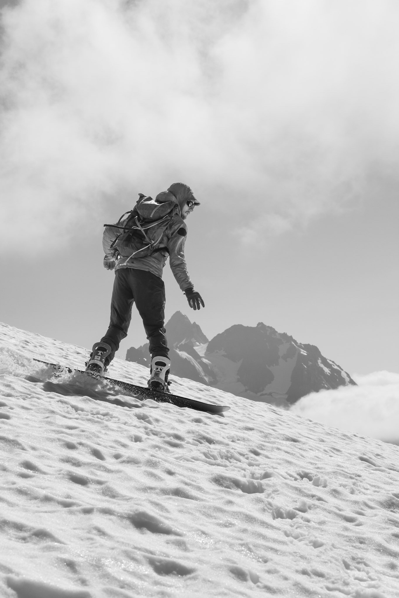 Ryan snowboarding down Ruth Mountain
