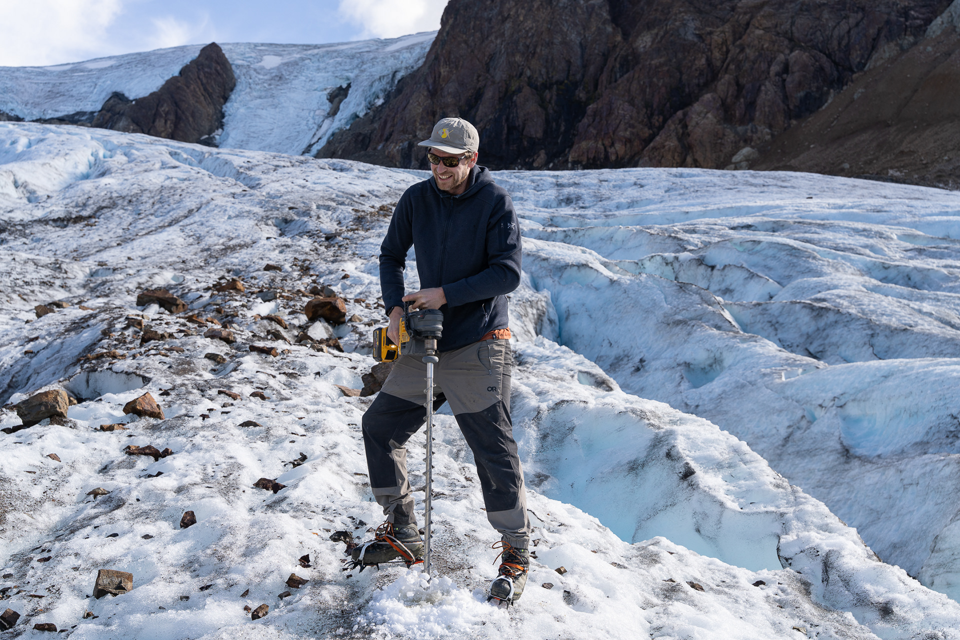 Jeff drilling into the ice to install an ablation stake