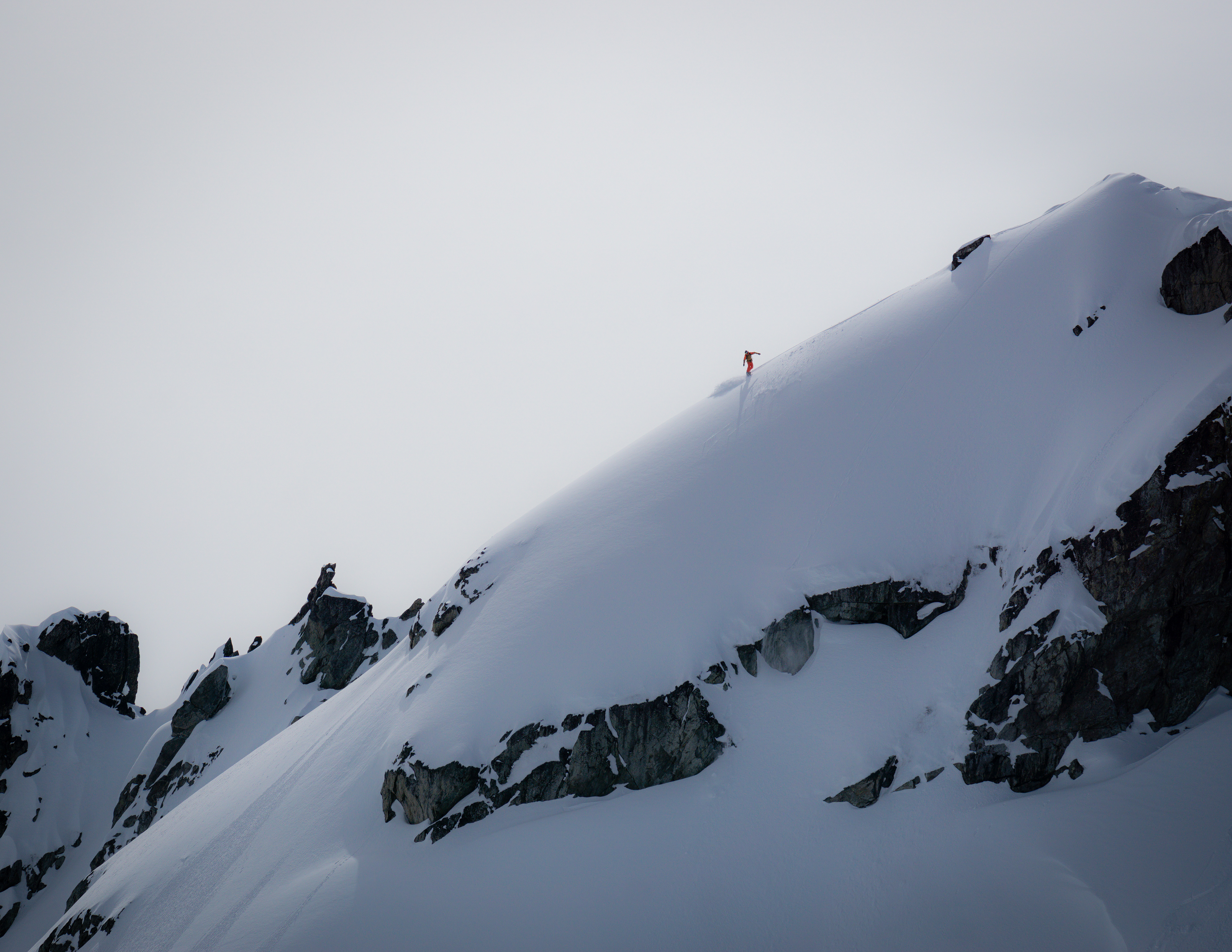 Backcountry snowboarder on Blackcomb Peak
