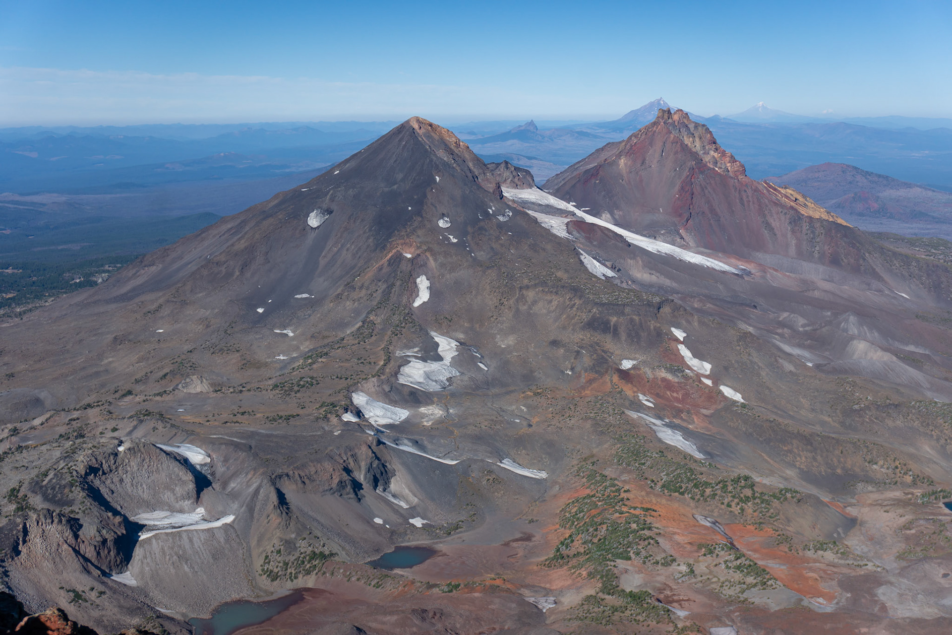 Middle Sister, North Sister, Three Fingered Jack, Mt. Jefferson, Mt. Hood, and Mt. Adams in the distance