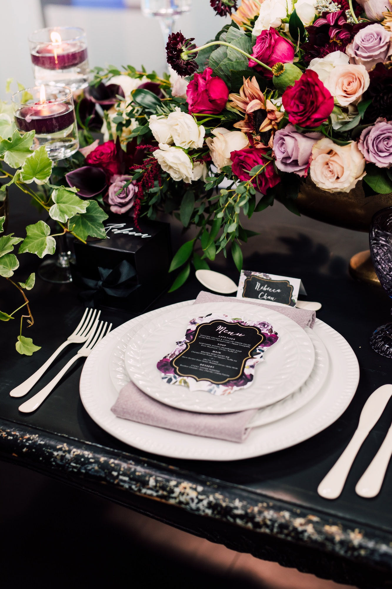 White plates pop against the black table top and create a canvas for the Menu as a focal point