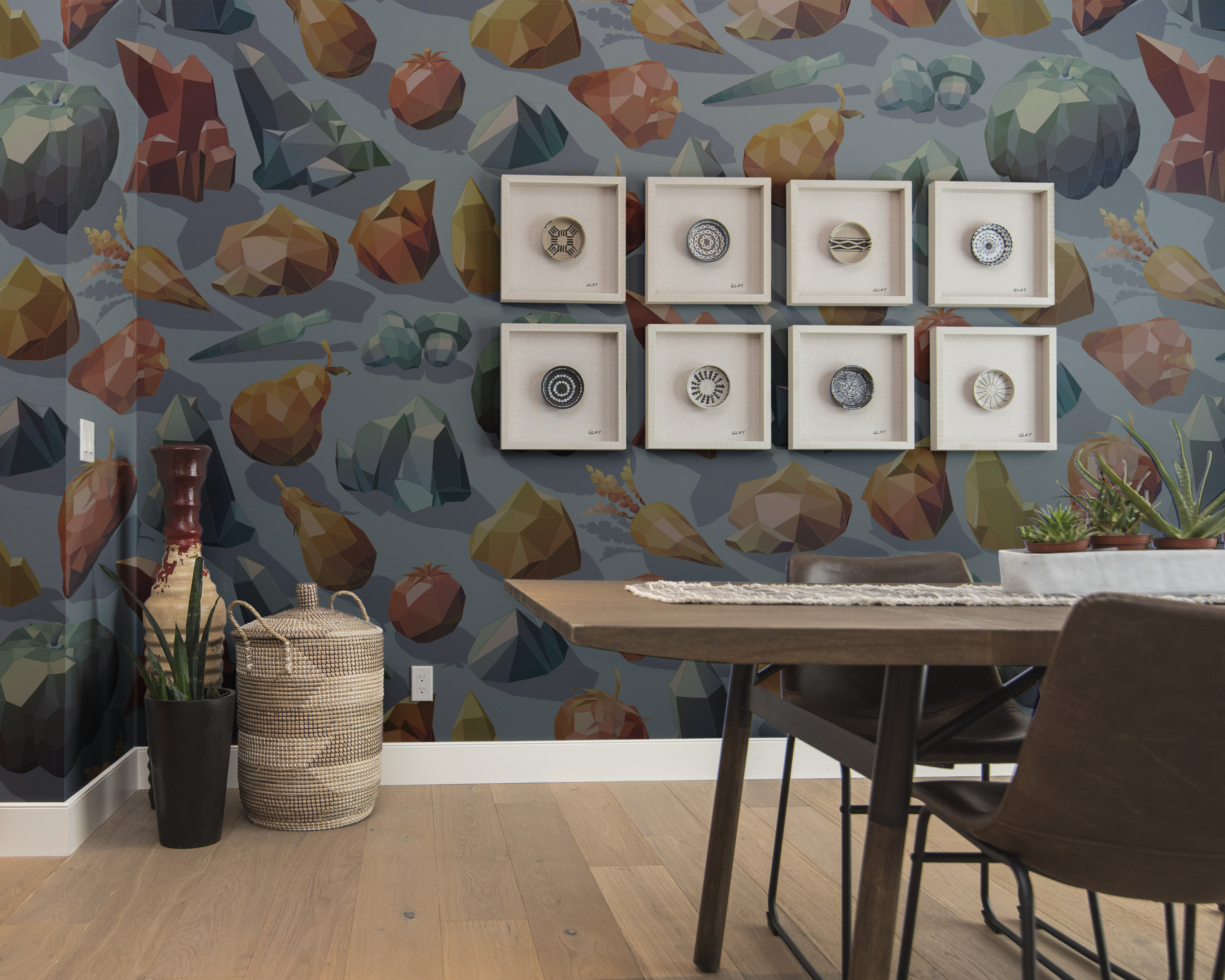 Photograph of a bespoke fruity silver patterned wallpaper in a kitchen setting.