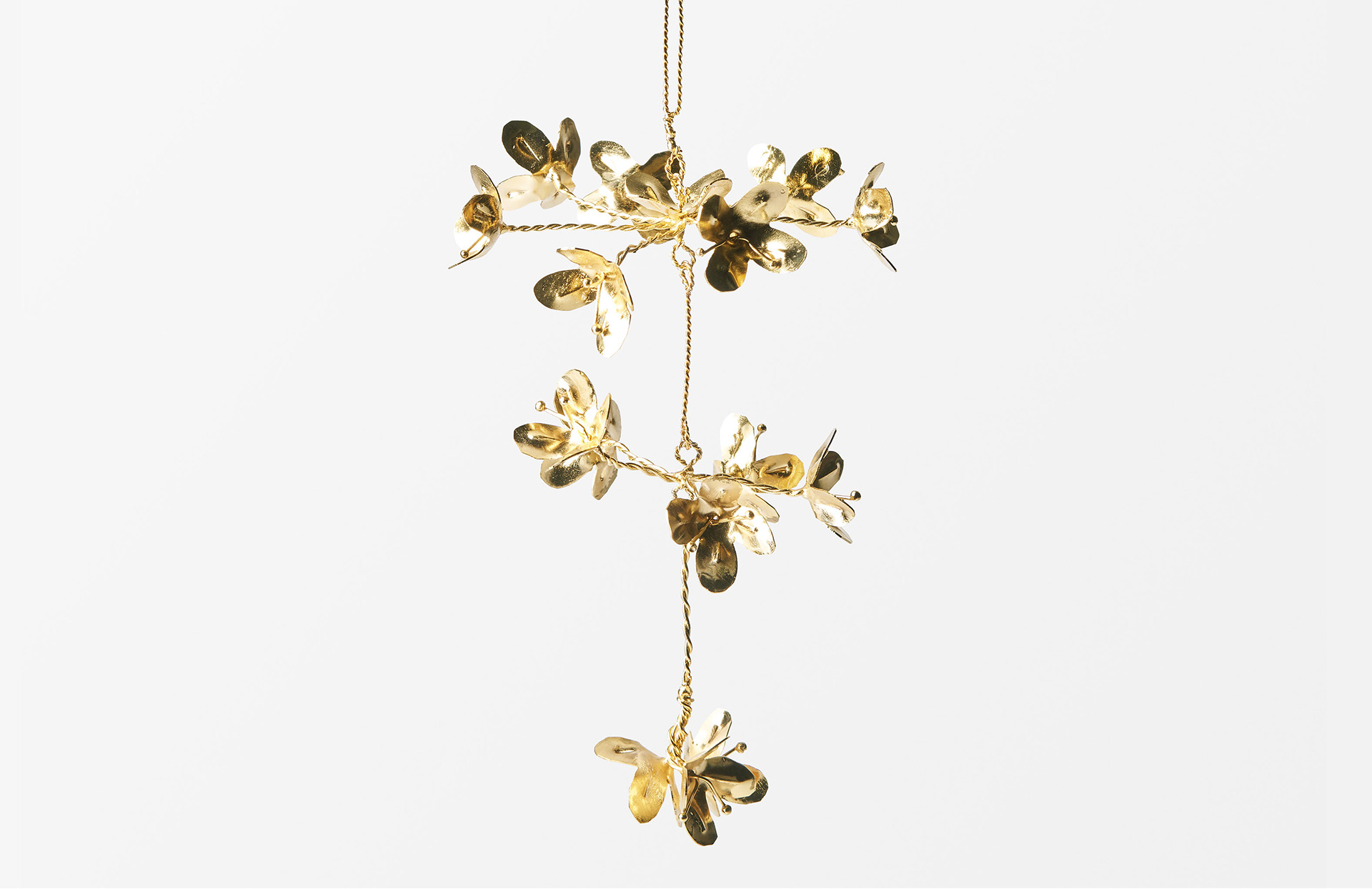 Brass wisteria flower Christmas tree ornament designed by Sam Wilde.