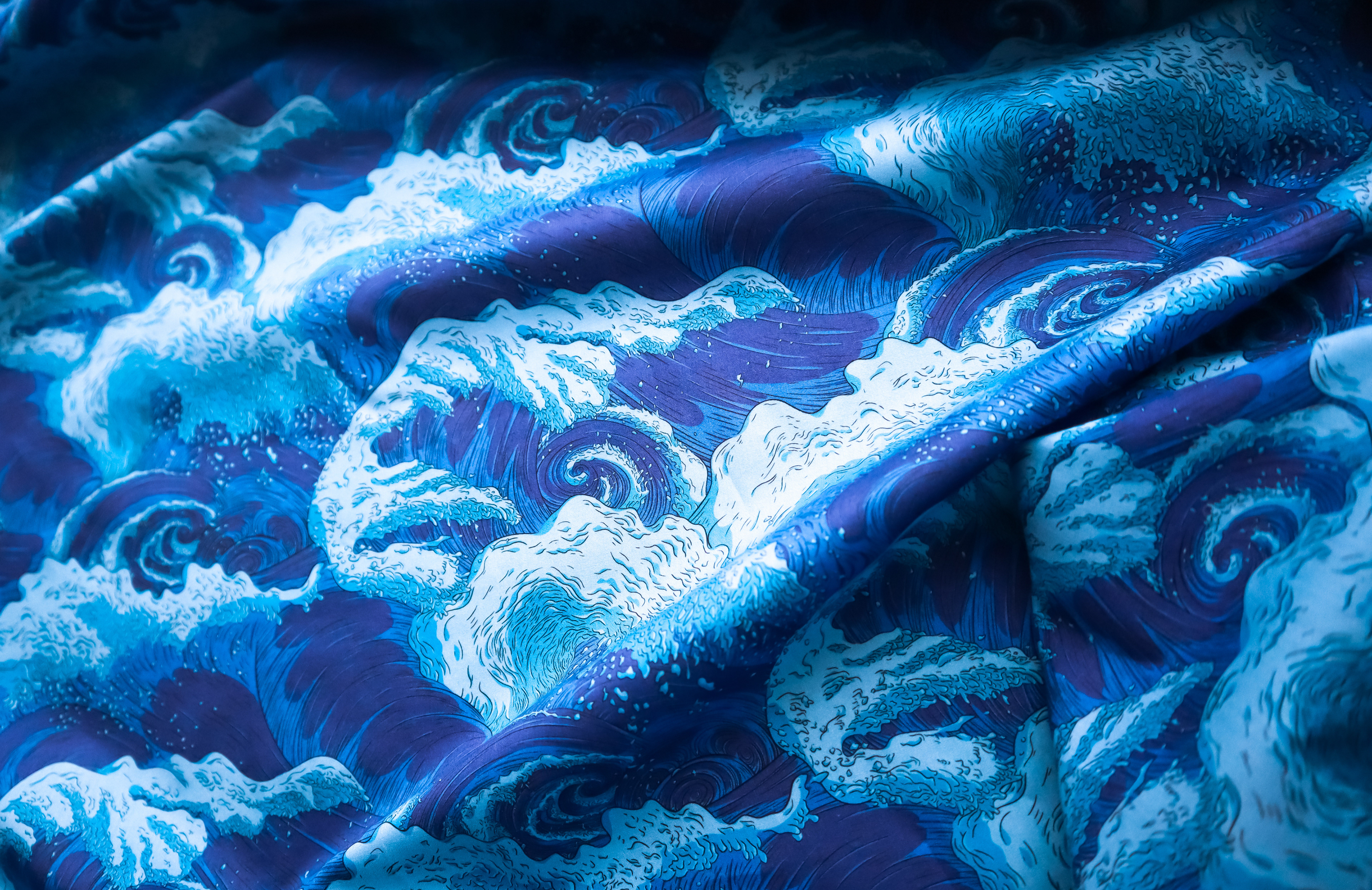 Wave pattern illustrated by Sam Wilde printed onto Tana Lawn cotton for Liberty Fabrics.