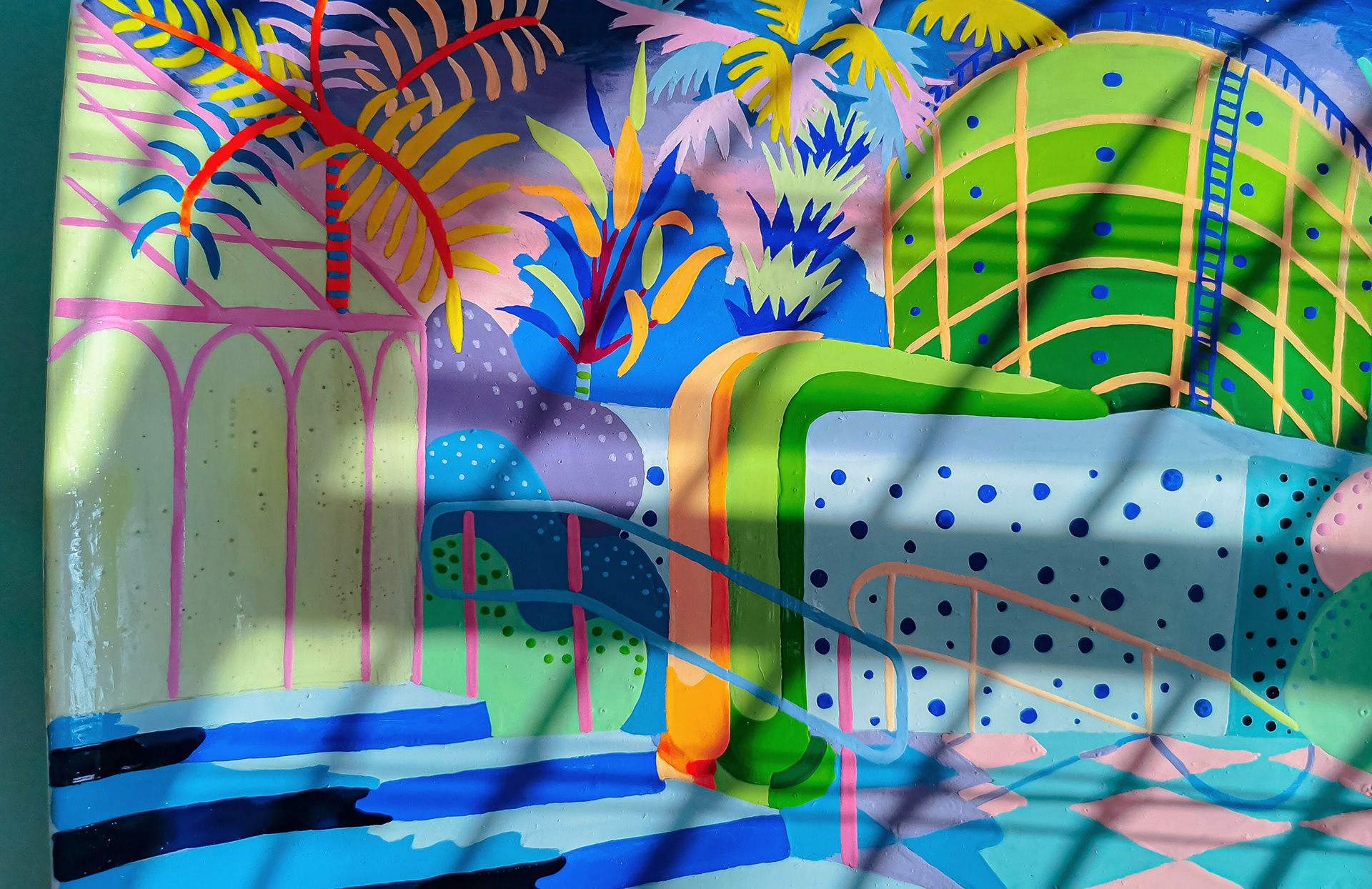 A vibrant hand-painted ceramic showing a nuclear powerplant overgrown with plant life.