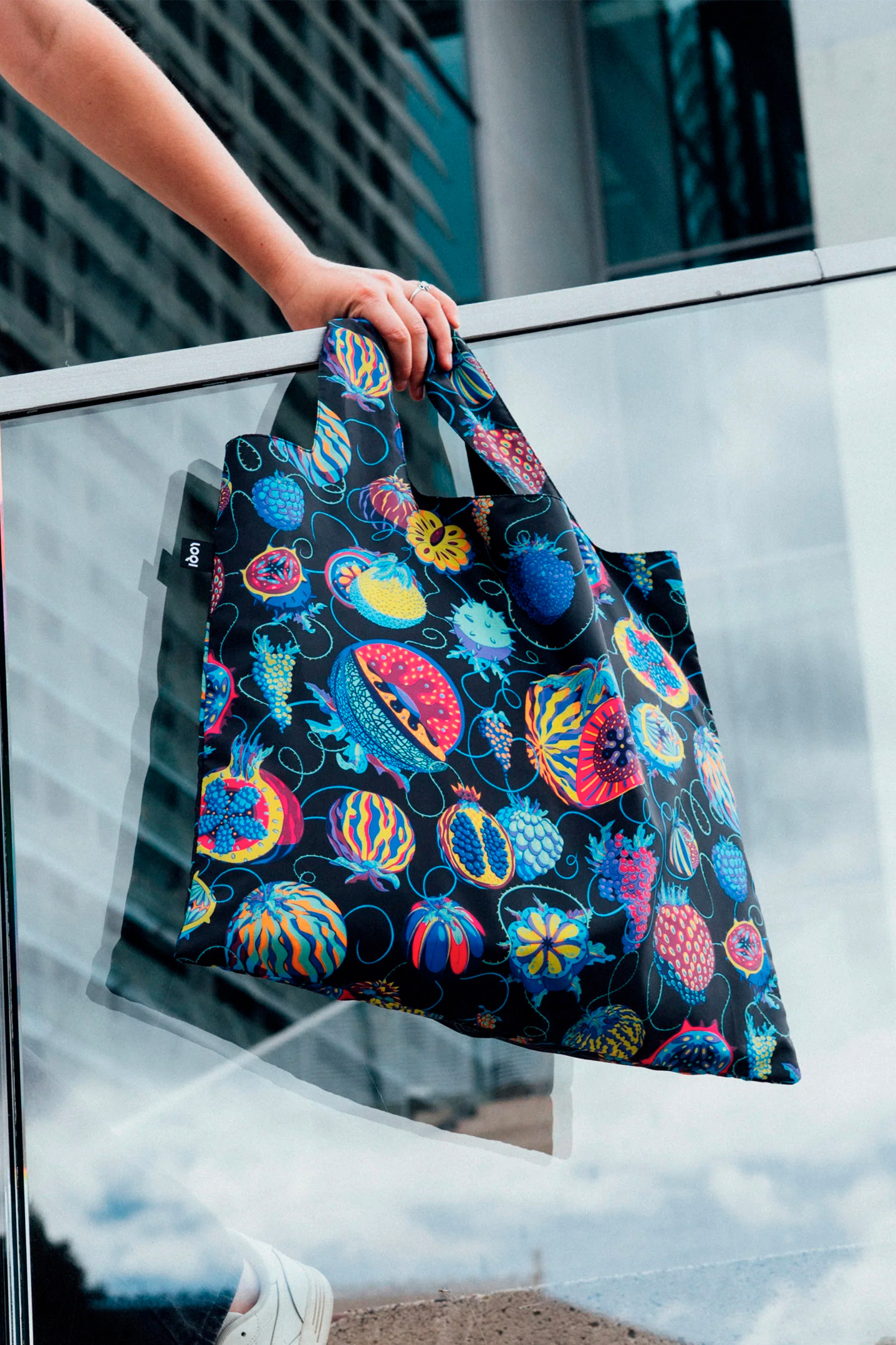 LOQI everyday bag by Sam Wilde shown in urban street setting, wearable art meets eco-design.