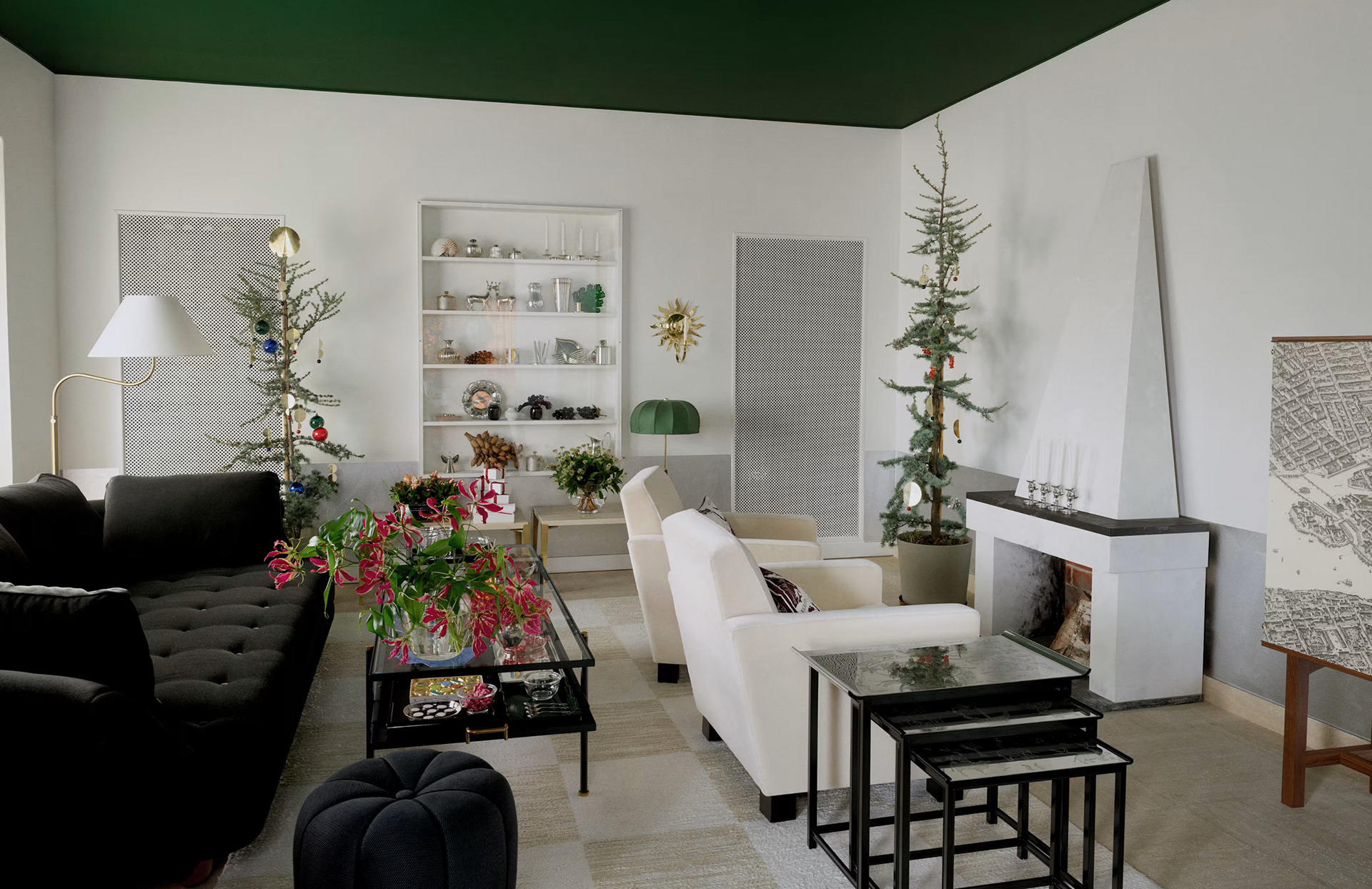 A Svenskt Tenn interior styled for Christmas, featuring brass and glass Poison of Eden ornaments by Sam Wilde, paired with contemporary Scandinavian design.