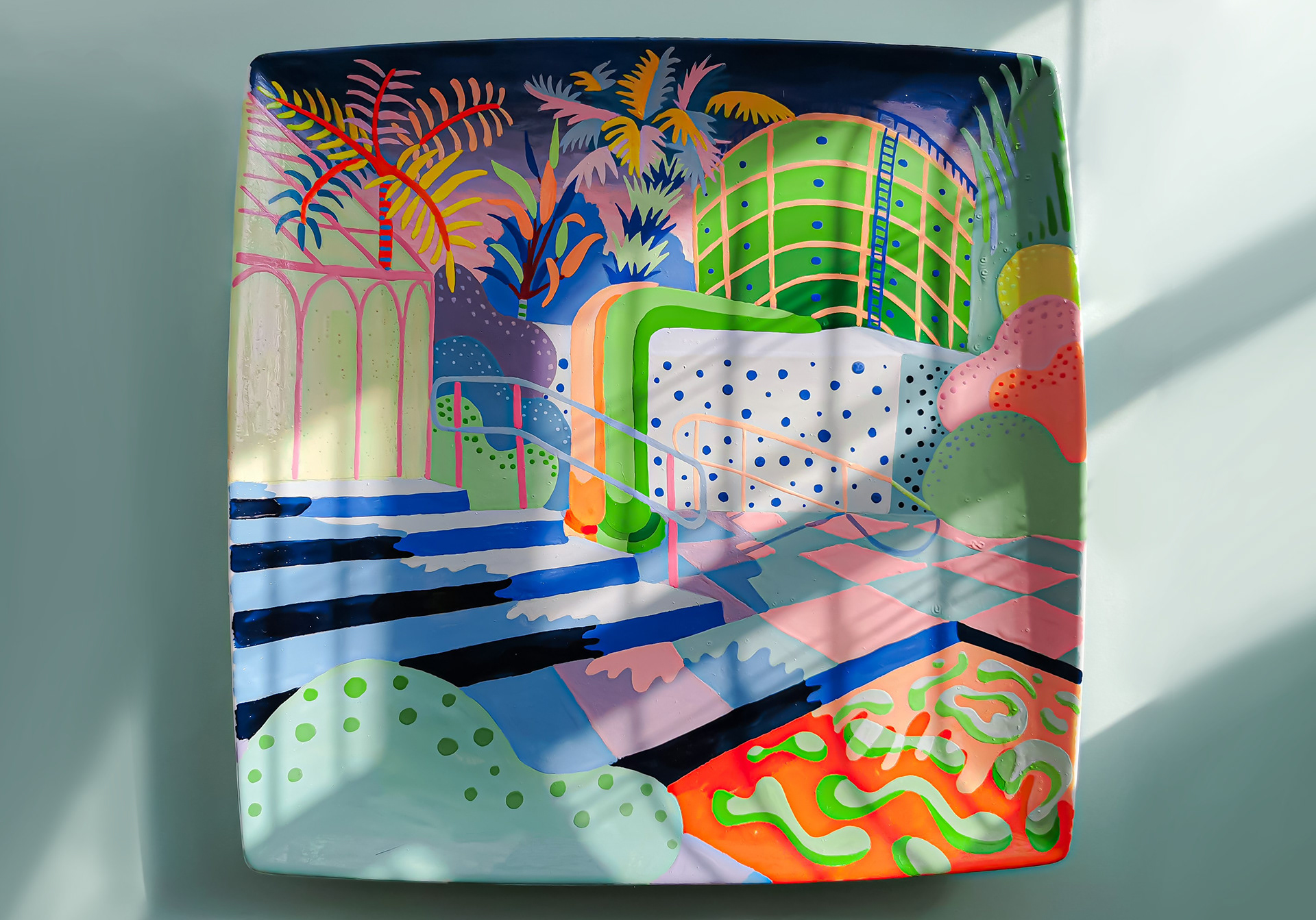 Hand-painted square ceramic showing a nuclear powerplant overgrown with tropical plant life.