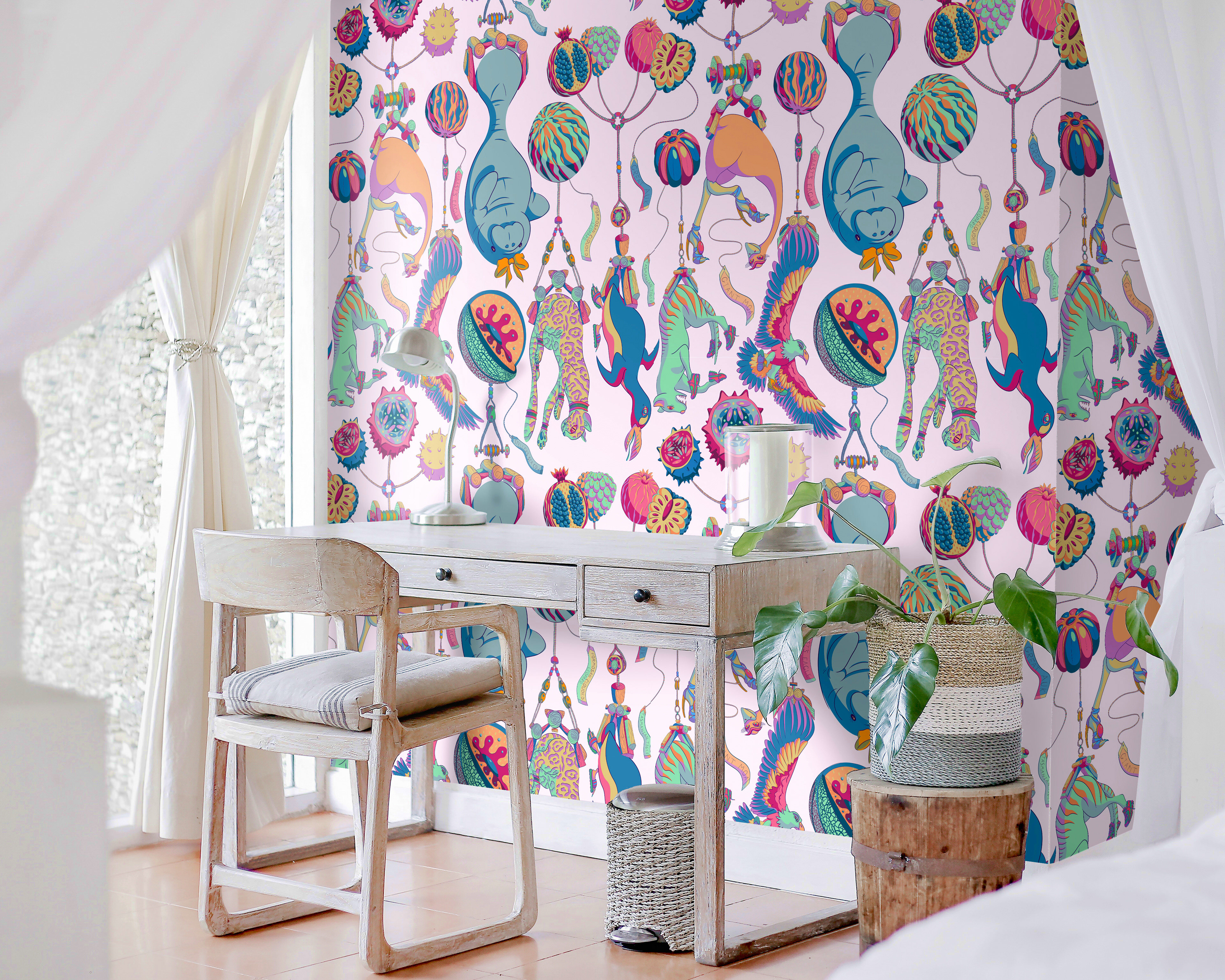 Pink patterned wallpaper of floating circus animals next to a large window and writing desk.