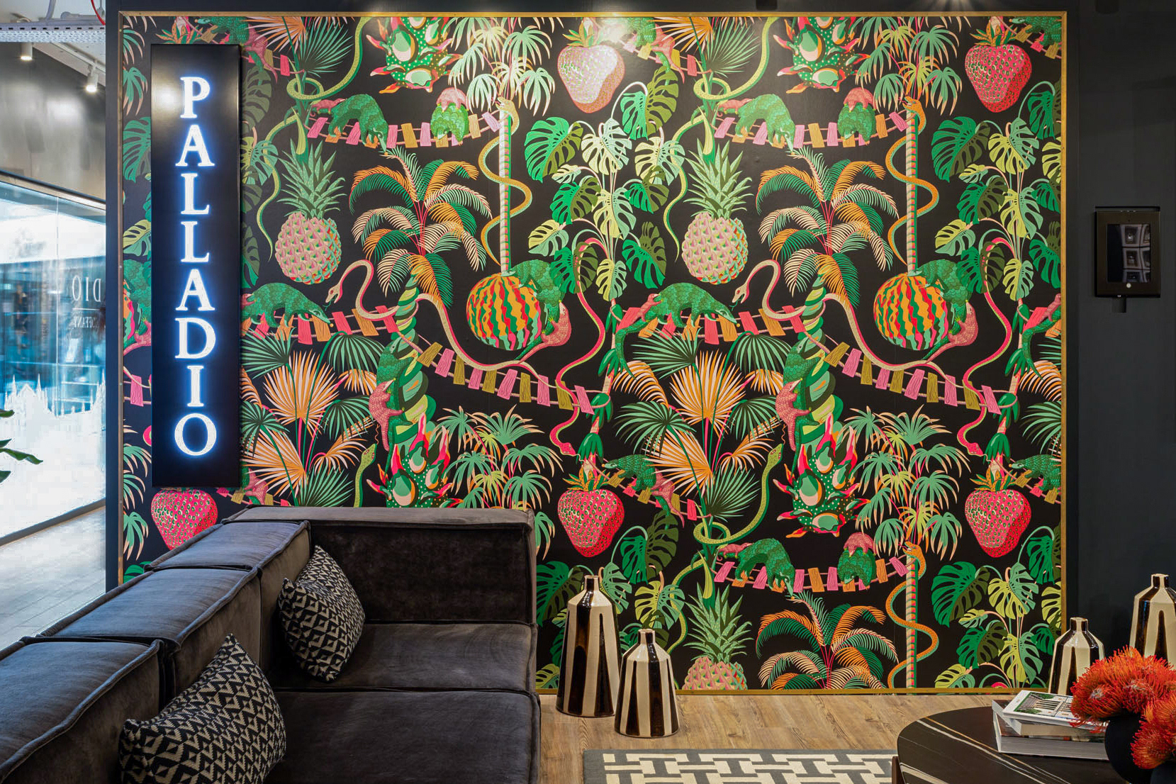 Palladio showroom in Chelsea Harbour showcasing the Precarious Pangolins wallpaper.