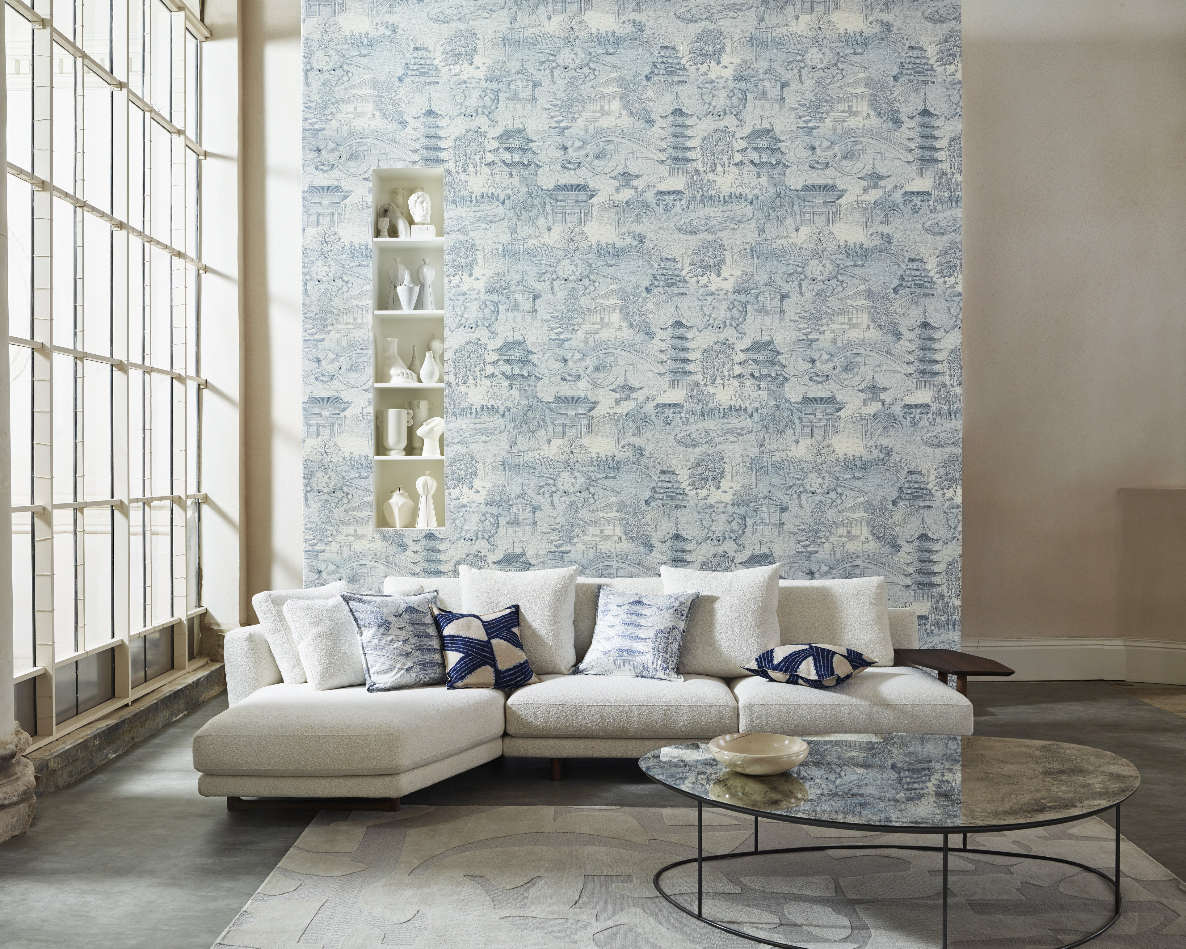 Large staged interiors shot by the Sanderson Design Group showcasing an illustrative wallpaper.