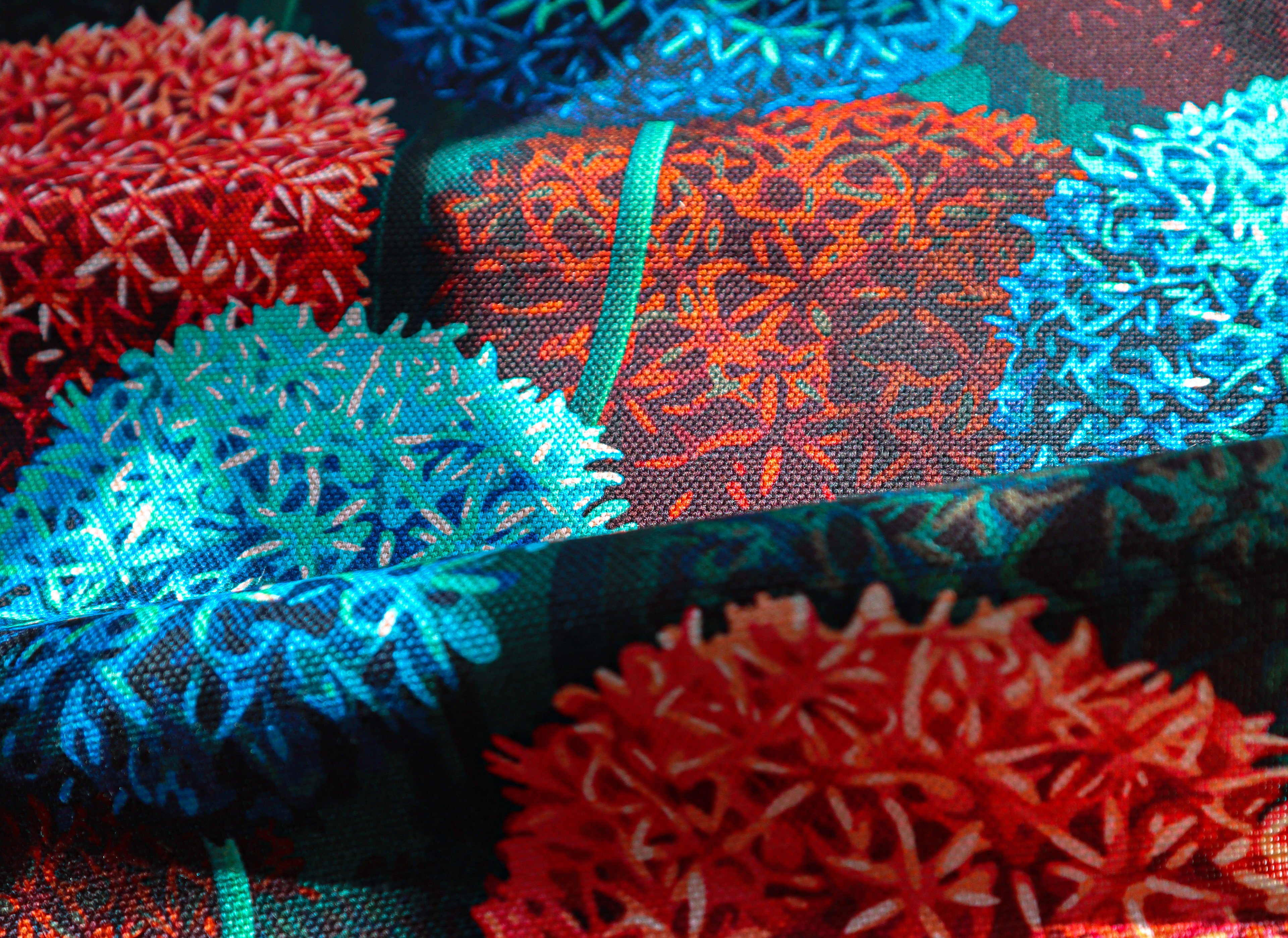 Printed textile image of red and blue painted alliums printed onto cotton linen