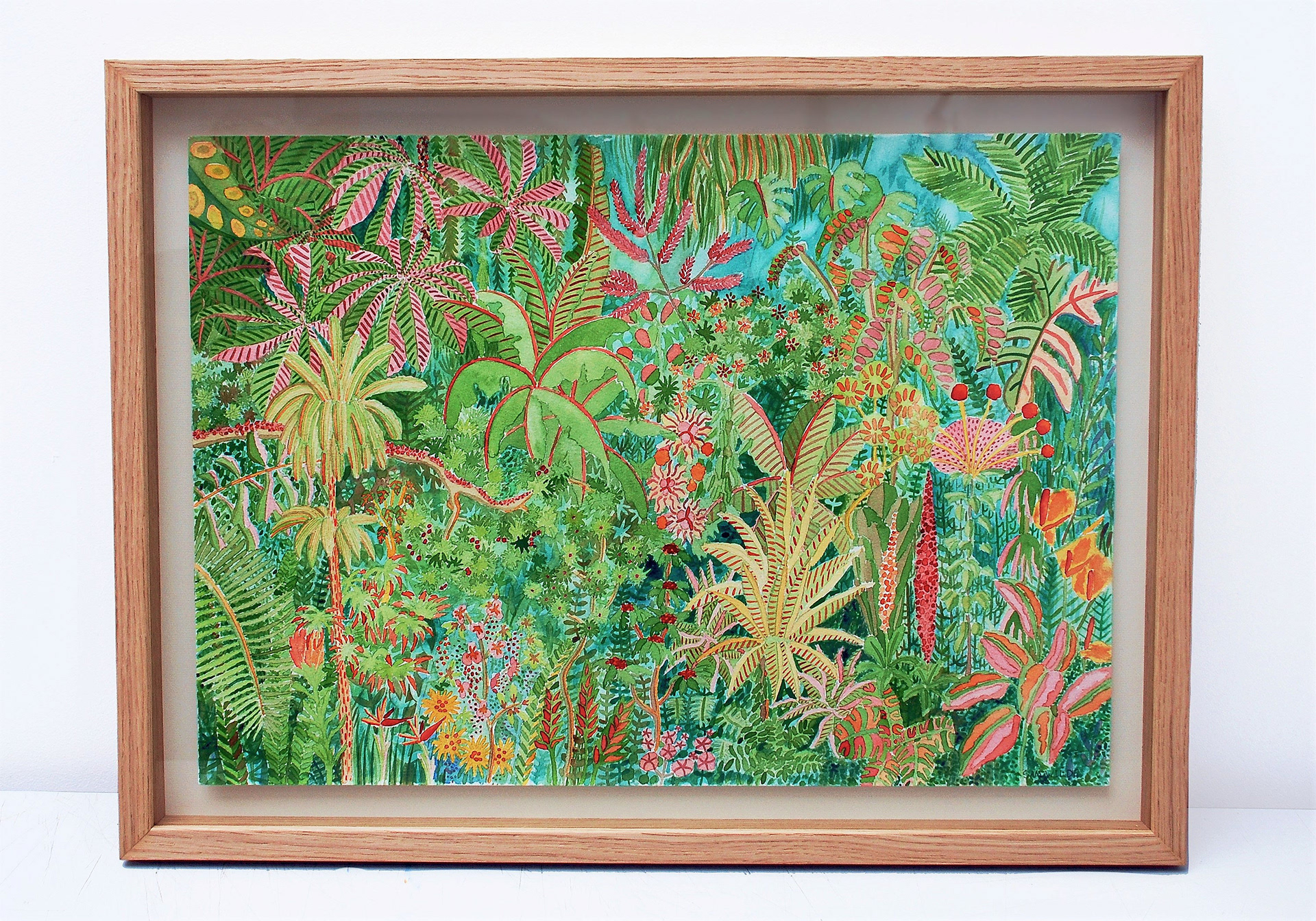 Framed watercolour painting of a jungle scene packed with multi-colour plant life.