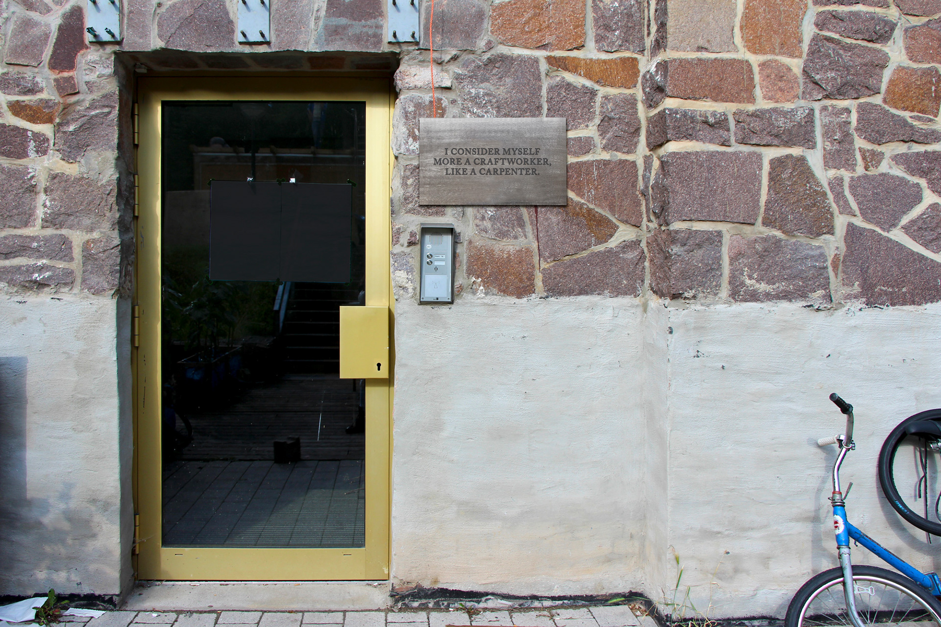 Plaque at the door of the Industrial Design Faculty: "I consider myself more a craftworker, like a carpenter" statement by Martin Wenzel