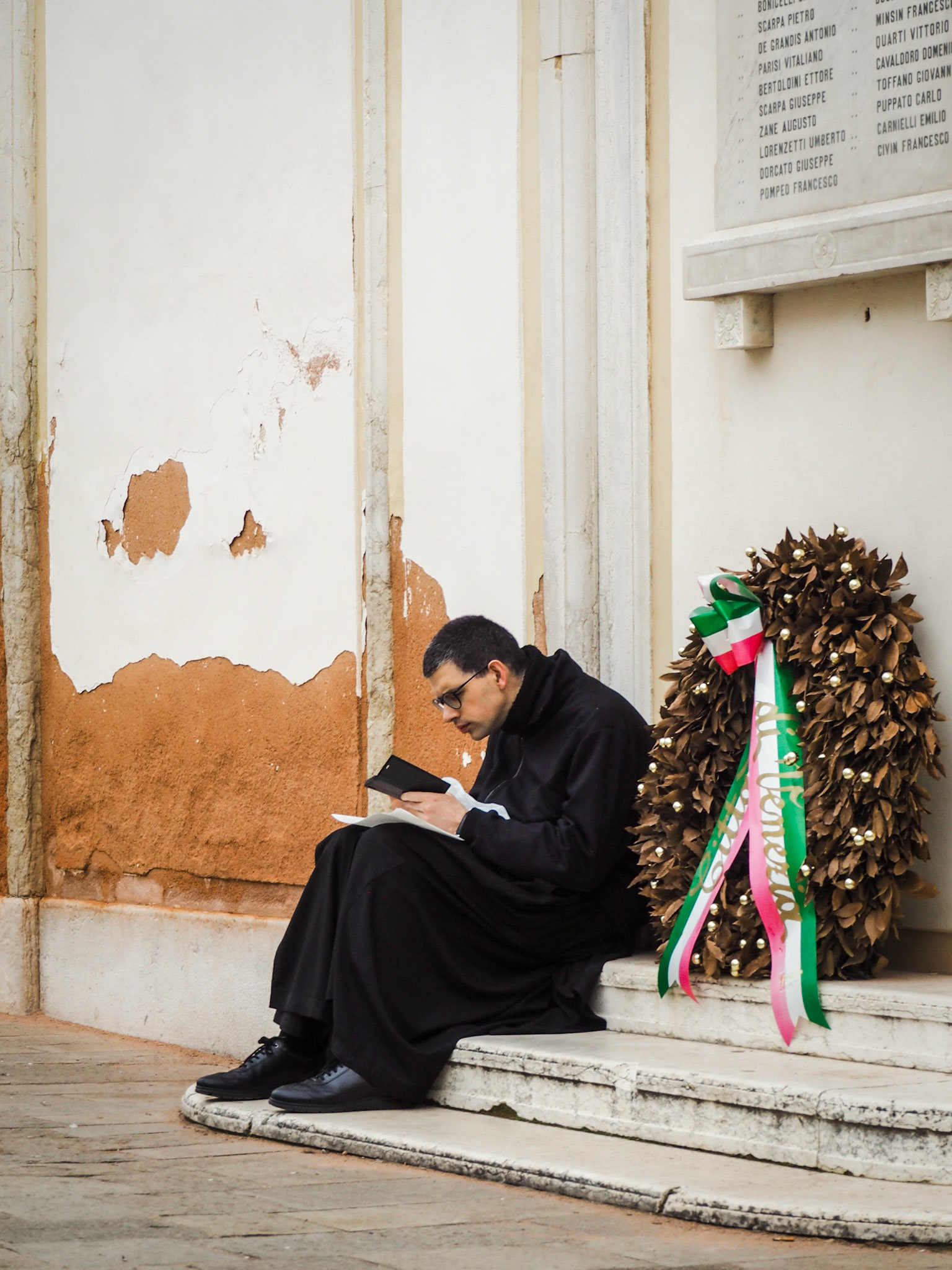 Priest studying his prayers