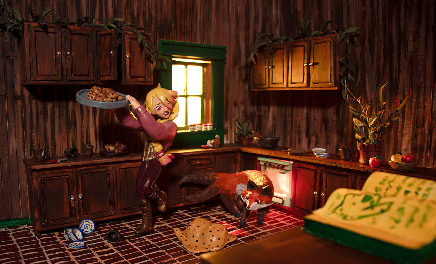 Illustration of a magical kitchen. There's an elf holding a tray of cookis and a fox, both of them are staring at some living cookie dough