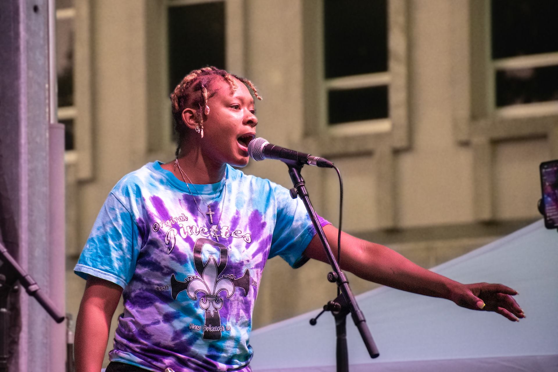IOWA CITY, IOWA – JUNE 6, 2025: Jazz Henry of The Original Pinettes Brass Band commands the mic with passion and power during their headline performance at the Iowa Arts Festival. Her vocal energy and stage presence lit a fire under the crowd, keeping the momentum alive all night.