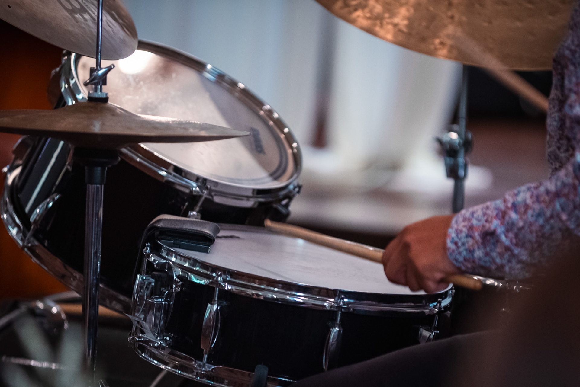 Drummer Kabir Dalawari’s sticks dance across the snare and cymbals, capturing the raw energy and improvisational spirit of the impromptu trio set at the Burlington Jazz Festival on July 26, 2025.