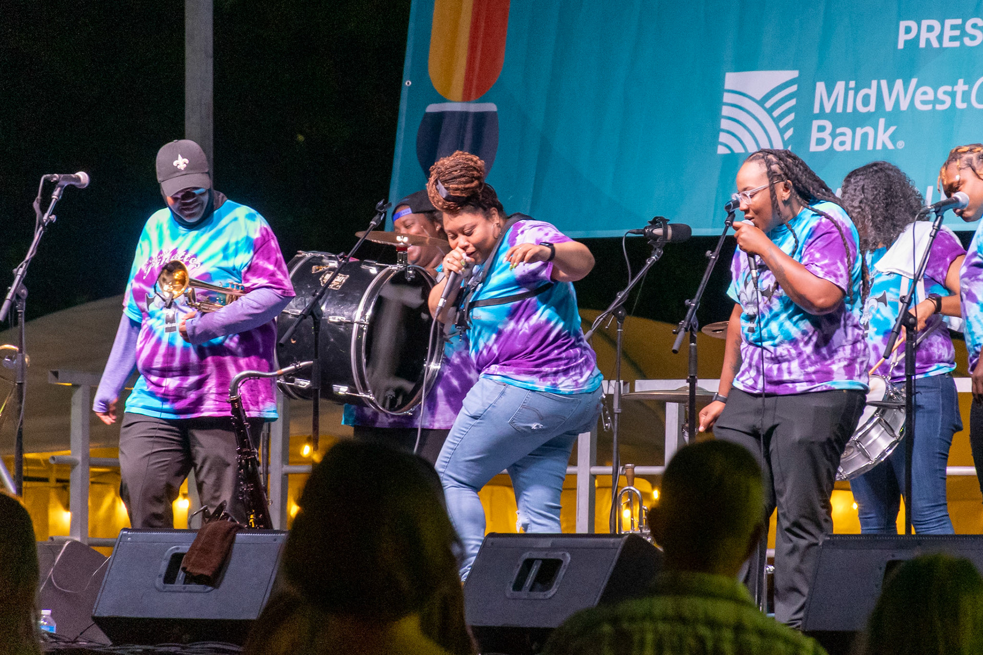 IOWA CITY, IOWA – JUNE 6, 2025: Members of The Original Pinettes Brass Band bring dance, laughter, and fierce musicianship to the stage during their Iowa Arts Festival performance. The all-female ensemble turned the night into a party, blending tight rhythms with a whole lot of soul.