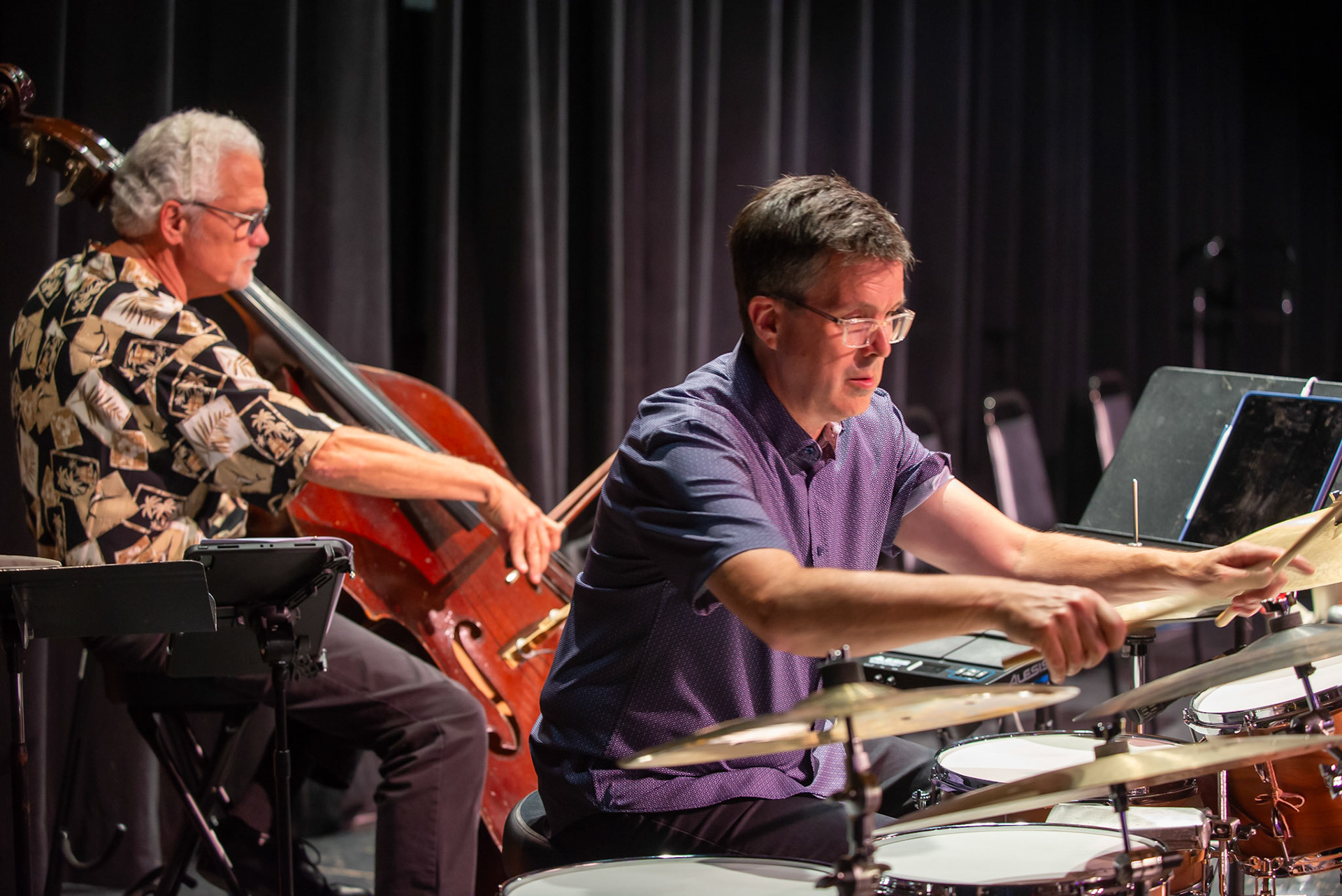Bassist Roger Hintzsche and drummer Doug Bratt perform with the Dave Katz Sextet, laying down a dynamic rhythm section during their set at the Burlington Jazz Festival on July 26, 2025.