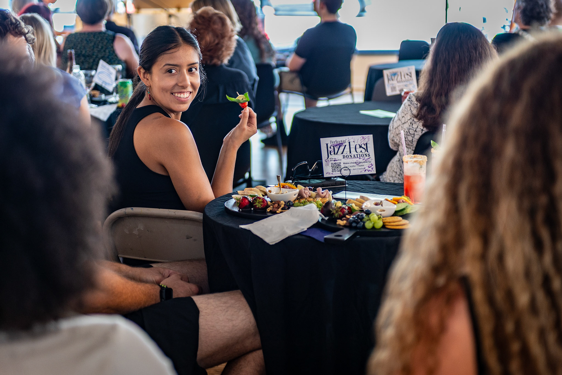 Festivalgoers enjoy charcuterie and drinks while listening to a solo piano performance at the Burlington Art Center during the Burlington Jazz Festival on July 26, 2025.